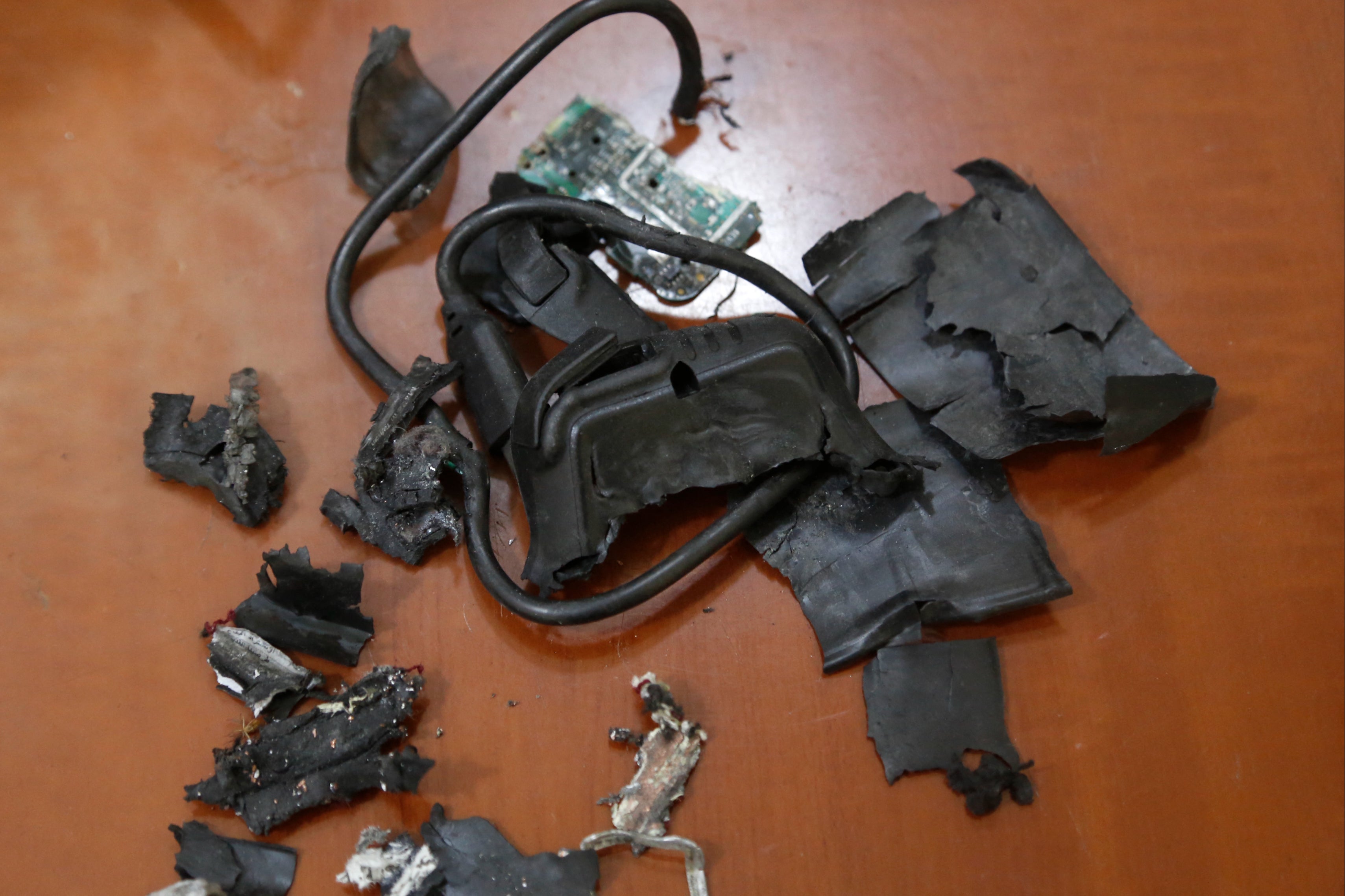 The remains of exploded pagers on display