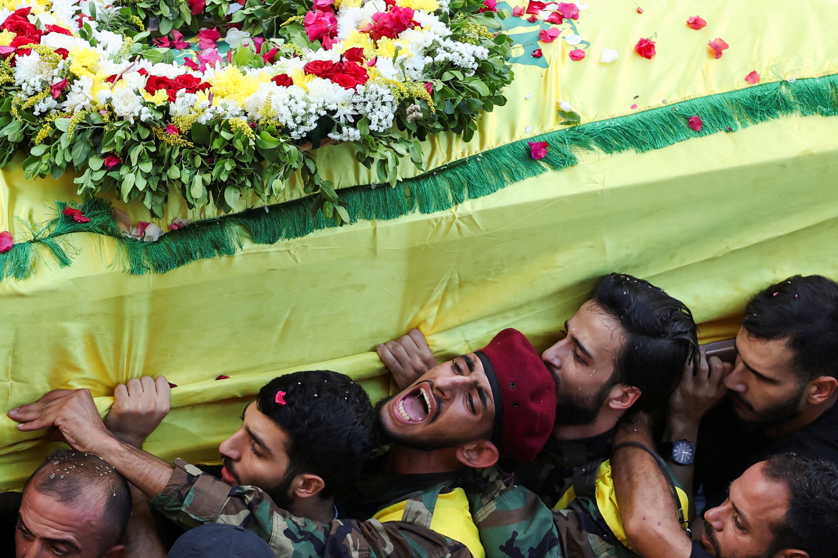 Men carry the coffin of Mohammad Mahdi Ammar, son of Hezbollah member of the Lebanese parliament, Ali Ammar, who was killed amid the detonation of pagers across Lebanon