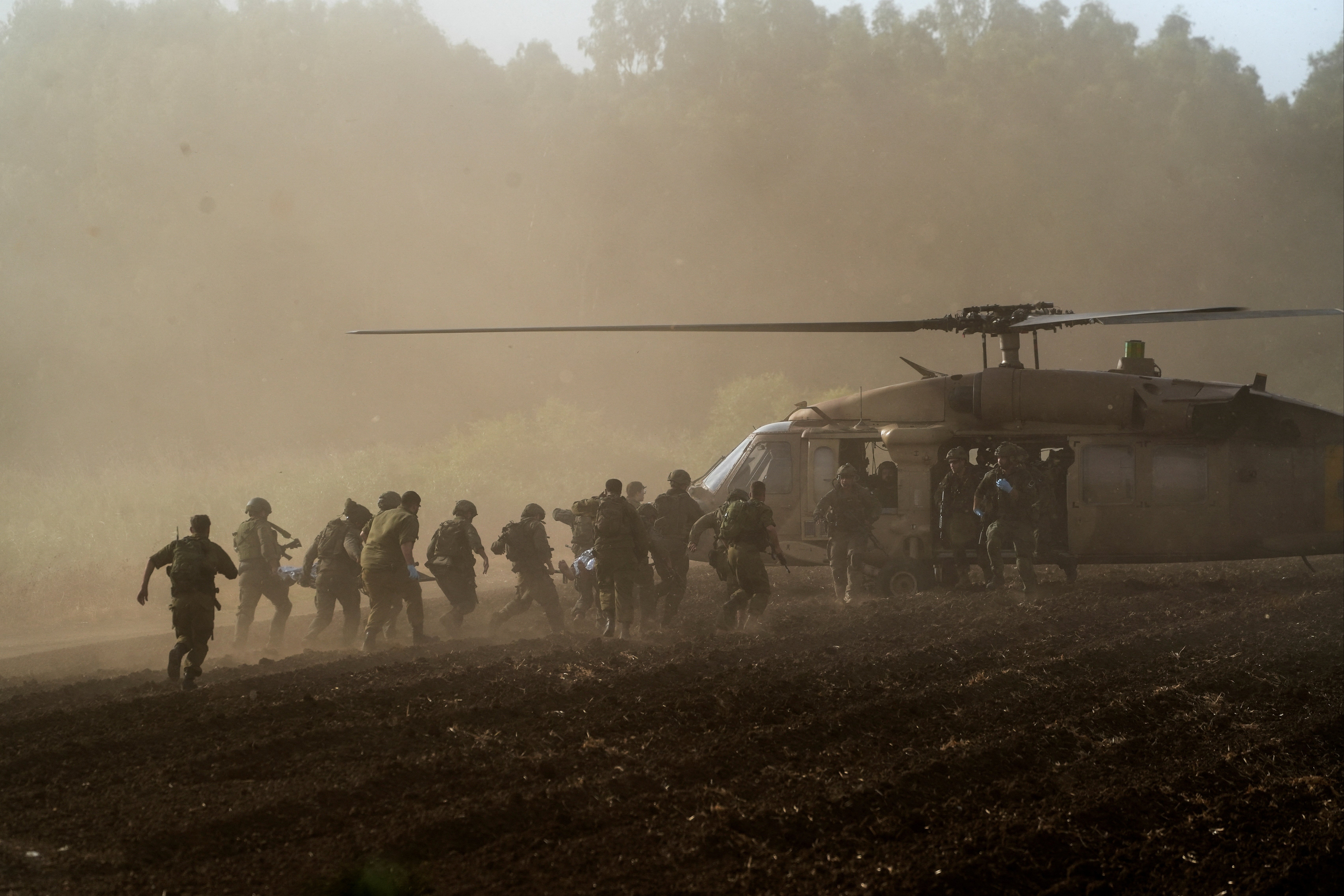 Israel's military evacuate injured people by helicopter after an anti-tank missile was fired into Israel from Lebanon