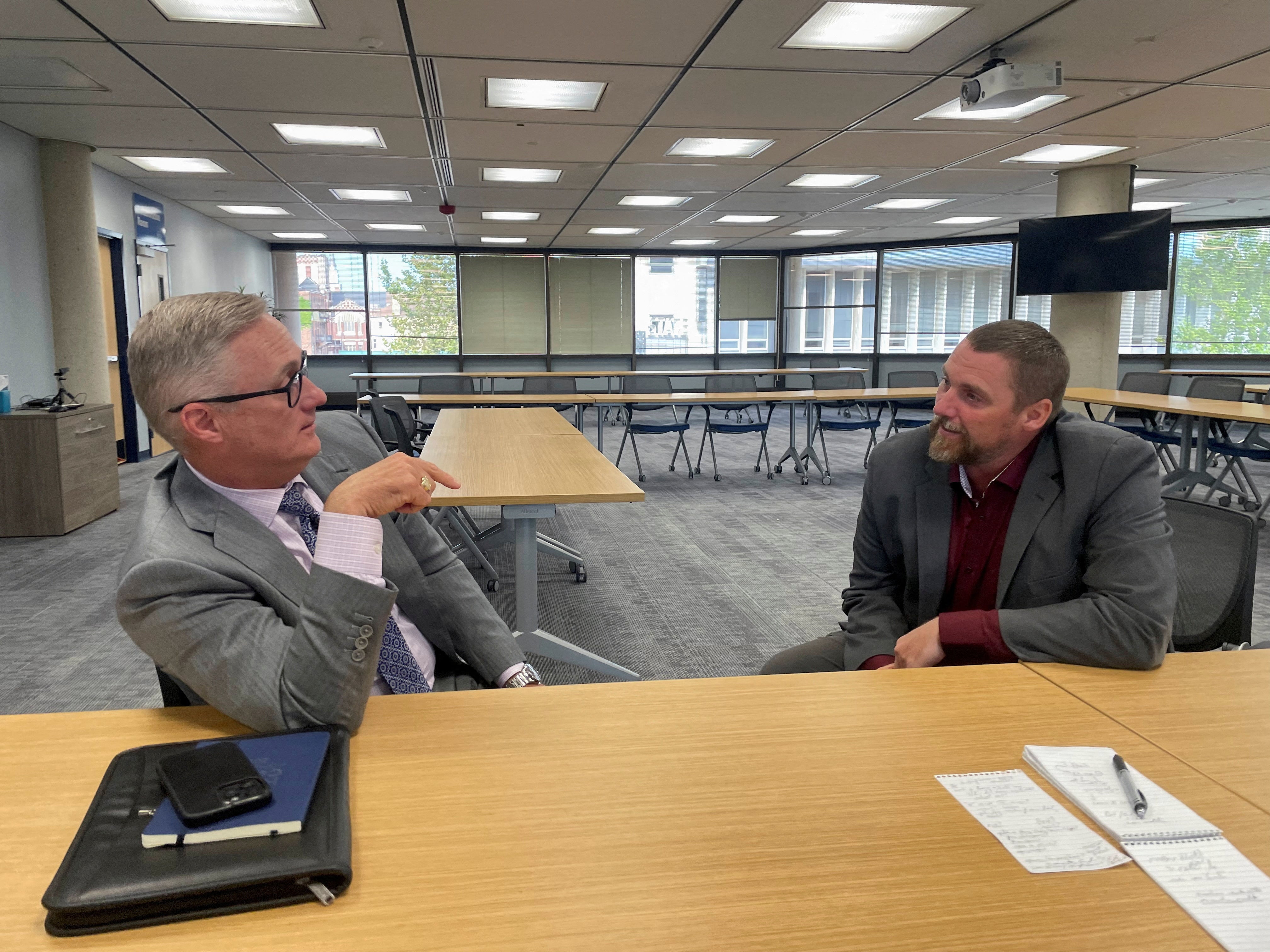 Springfield Mayor Rob Rue (left) speaks to City manager Bryan Heck. Both city officials have debunked Trump’s claim that Haitian immigrants are eating pets in the city