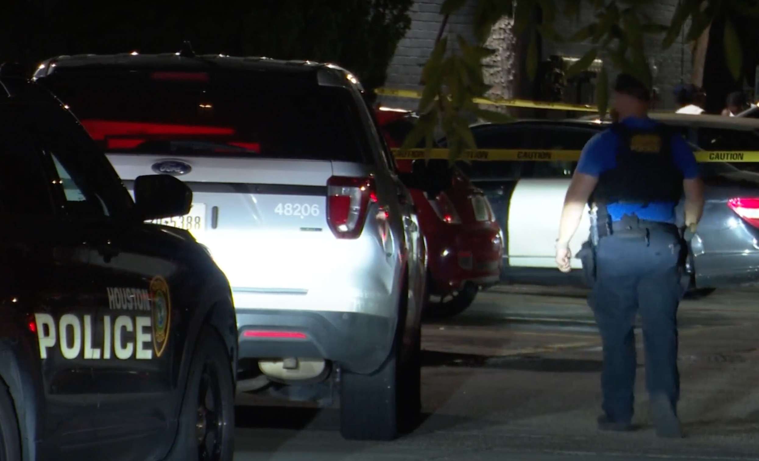 Police on the scene in Houston where a shooting left a father dead and a mother injured