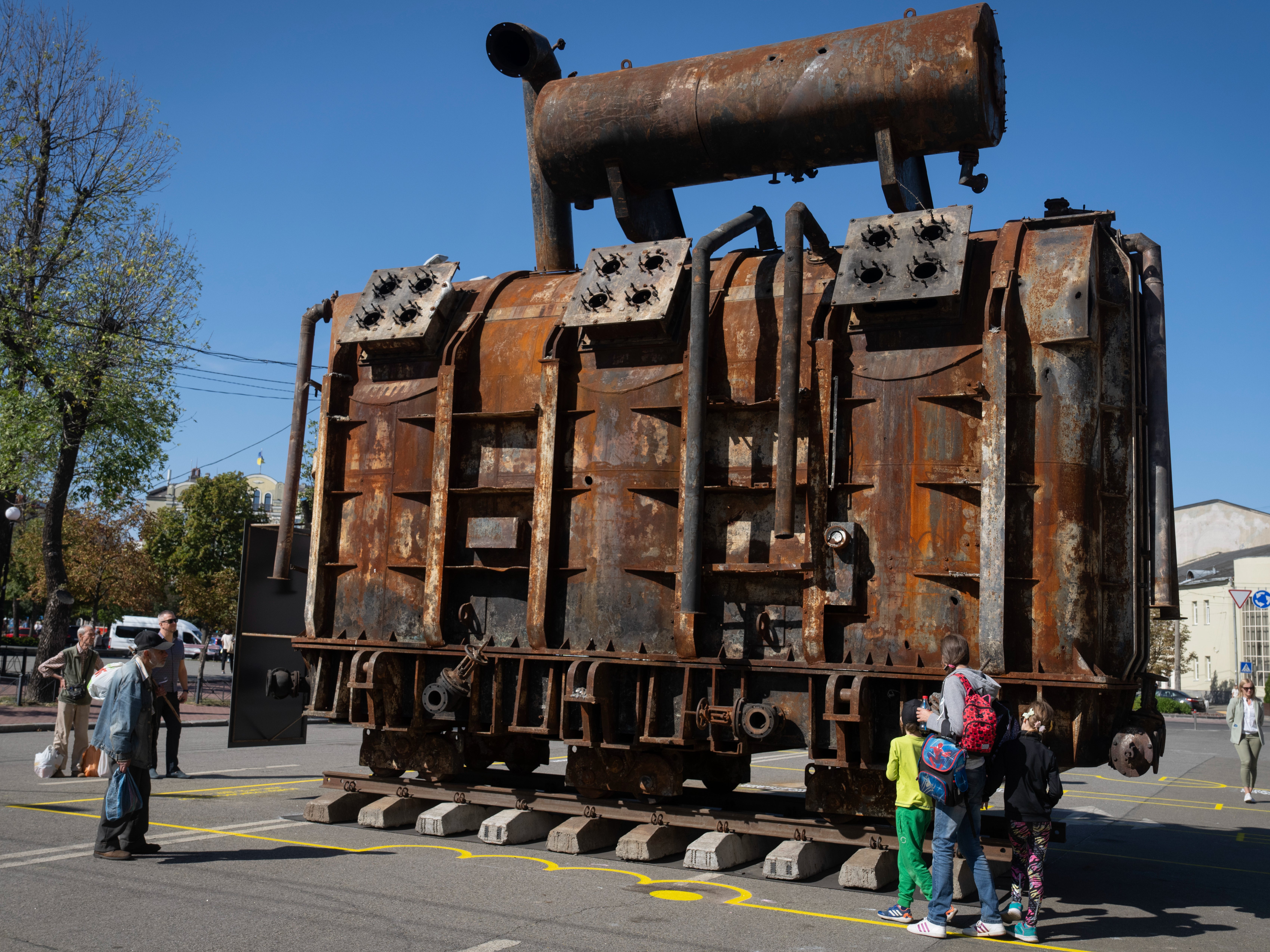 A burnt transformer from a power plant damaged in a Russian missile attack goes on display in Kyiv