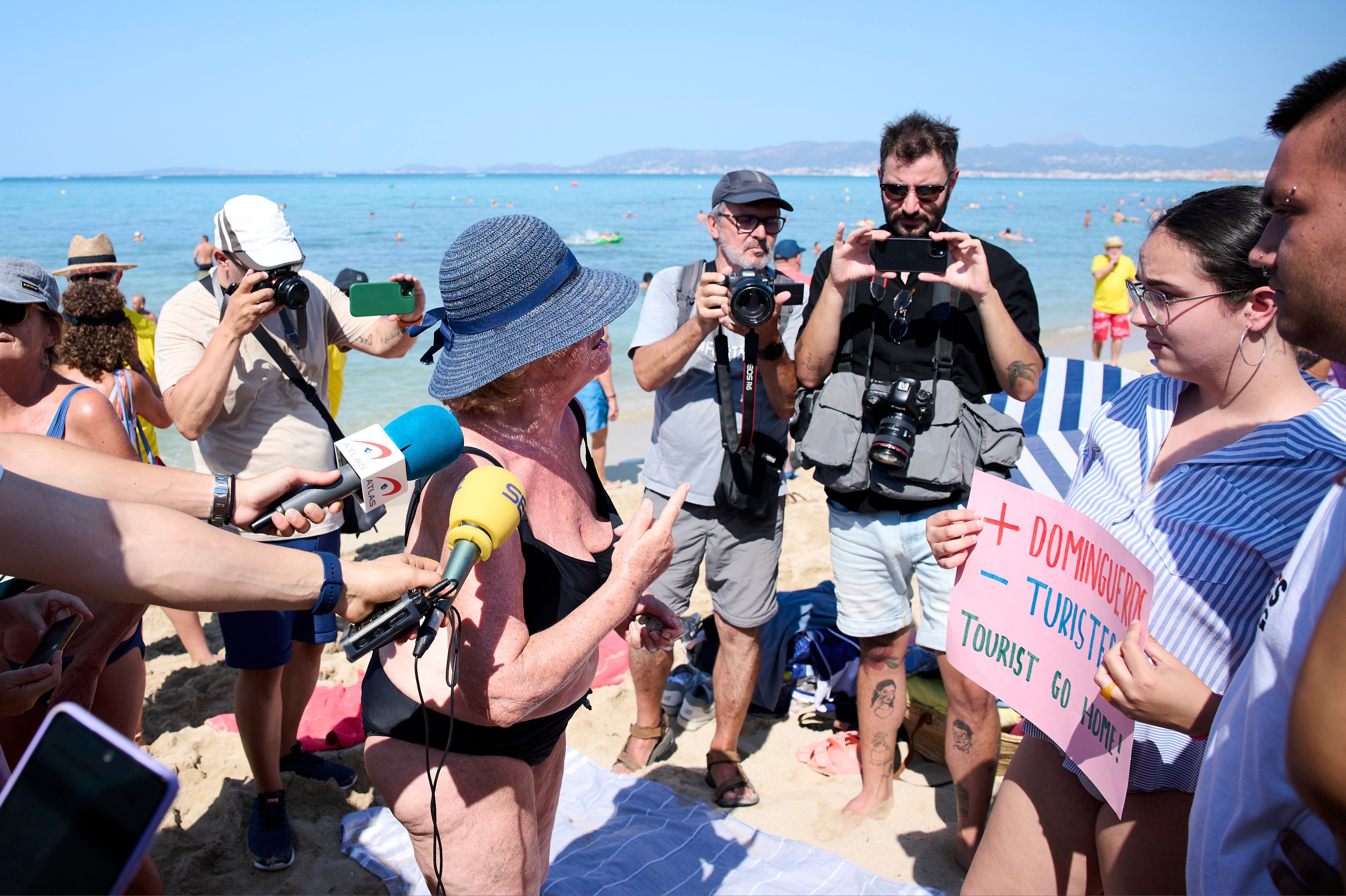 Members of the Mallorca Platja Tour association demonstrate against the tourist saturation on the beach of Palma de Mallorca last August