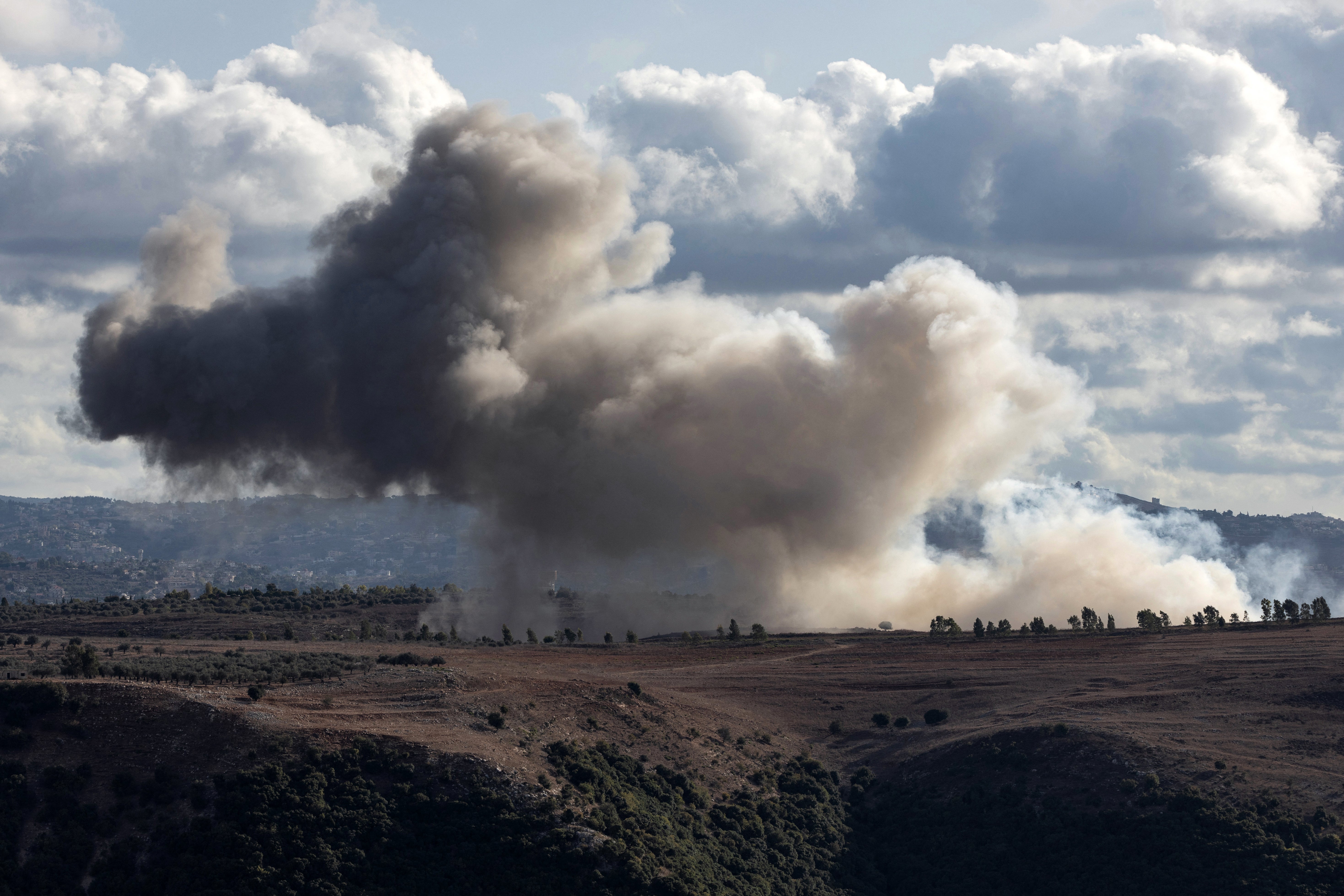 Smoke billows from the site of an Israeli strike that targeted the southern Lebanese border area of Alman al-Shumariyah