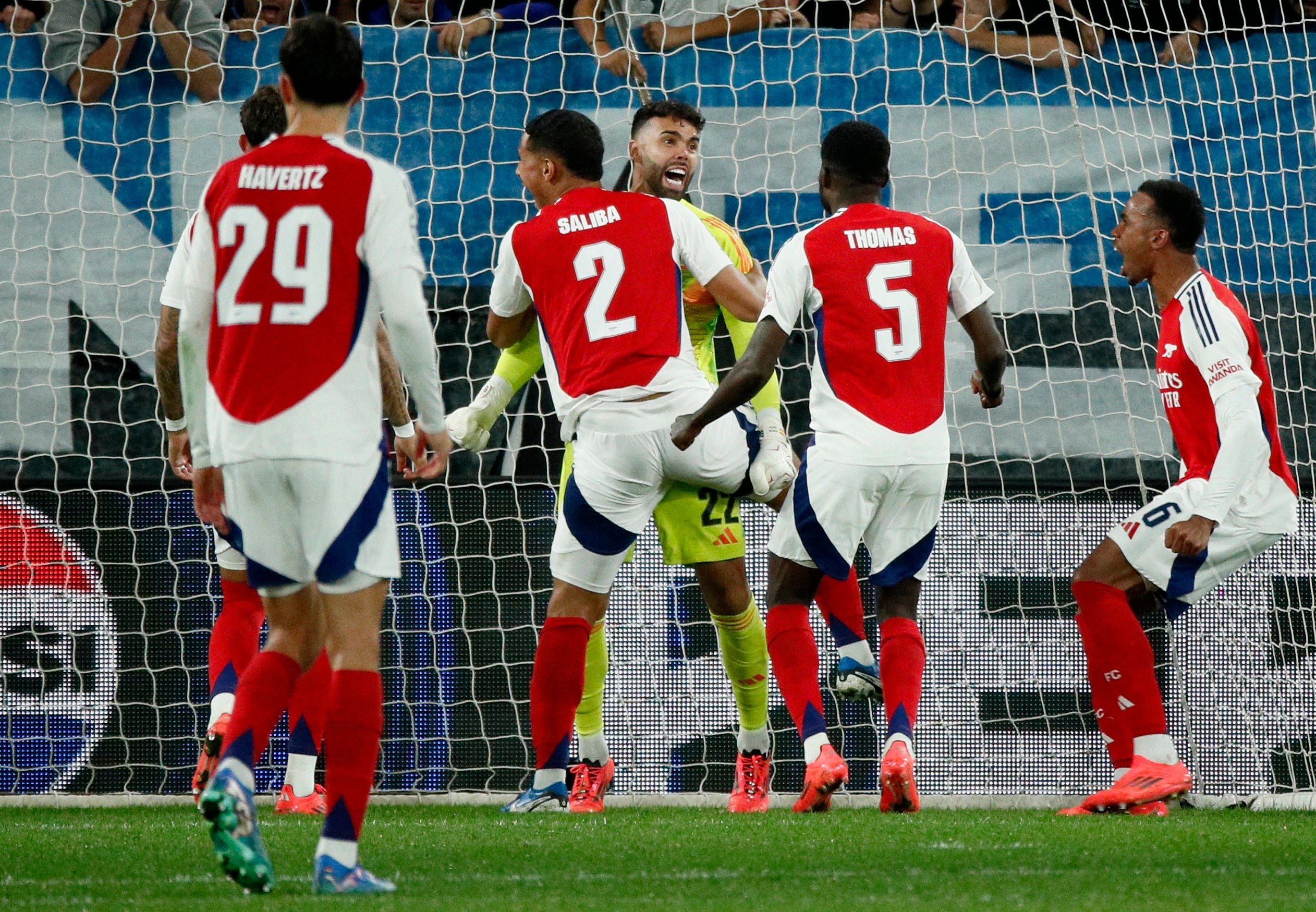 The goalkeeper was mobbed by his teammates