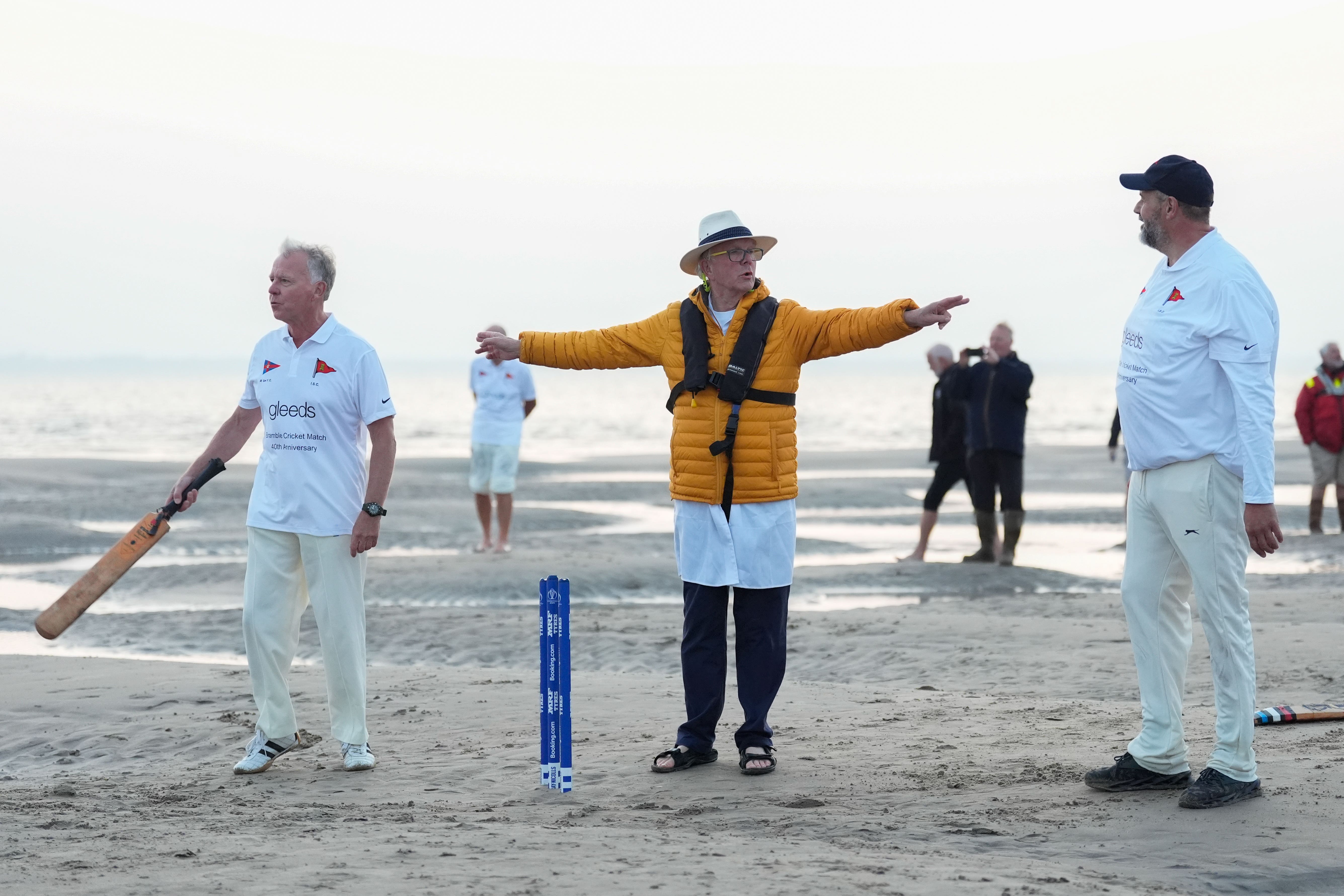 Members of the Royal Southern Yacht Club and the Island Sailing Club take part in the annual Brambles cricket match on the Bramble Bank sandbank in the middle of the Solent at low tide (Andrew Matthews/PA)