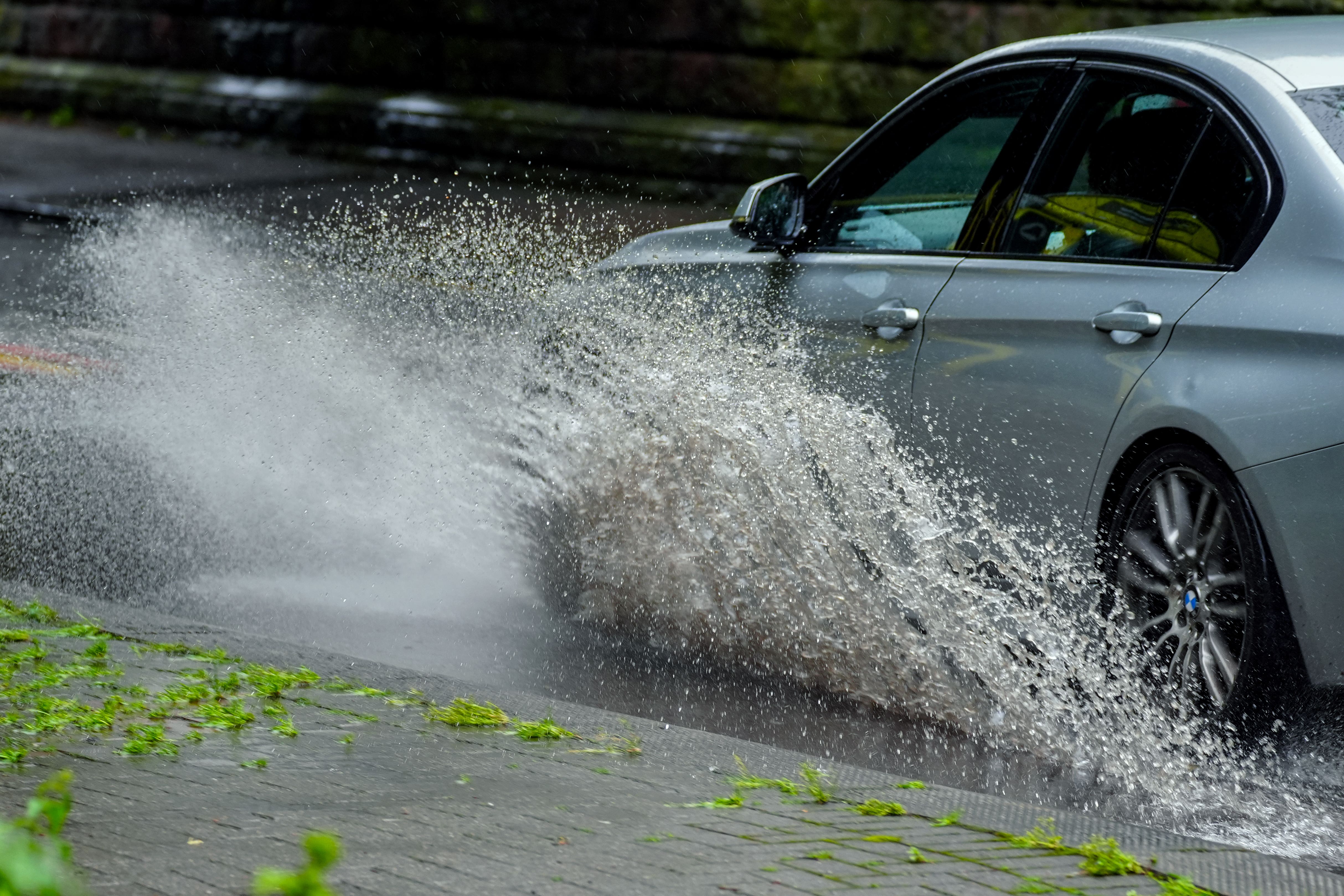 Rain, hail and lightning are forecast for some areas of the UK over the weekend (Peter Byrne/PA)