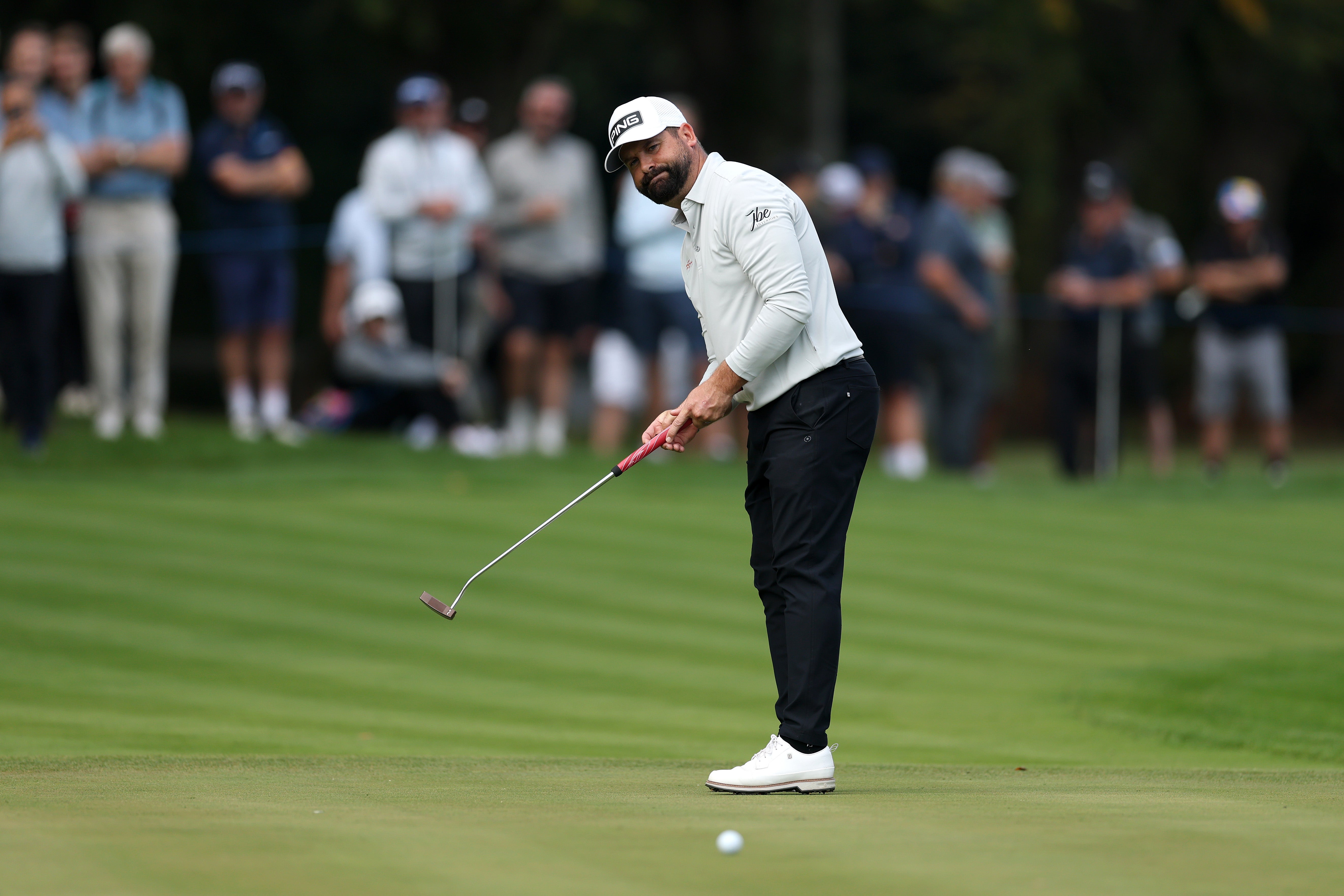 Baldwin’s birdie putt on the 18th stops beside the hole