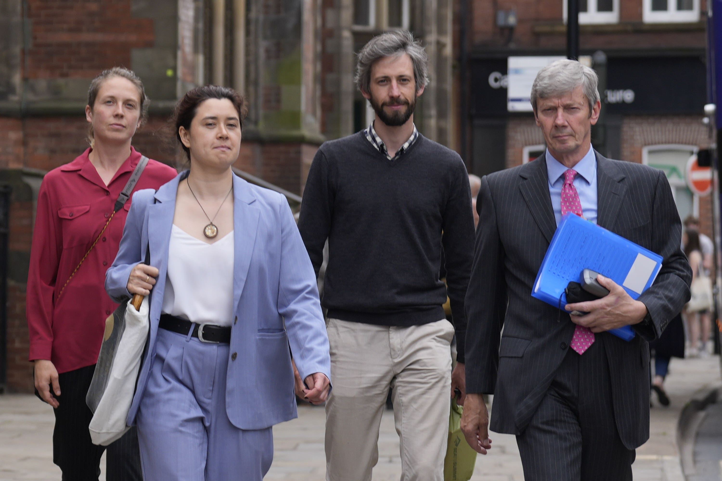 Greenpeace activists (left to right) Alexandra Wilson, Amy Rugg-Easey, Mathieu Soete and Michael Grant leave York Magistrates’ Court following an earlier hearing in July (Danny Lawson/PA)