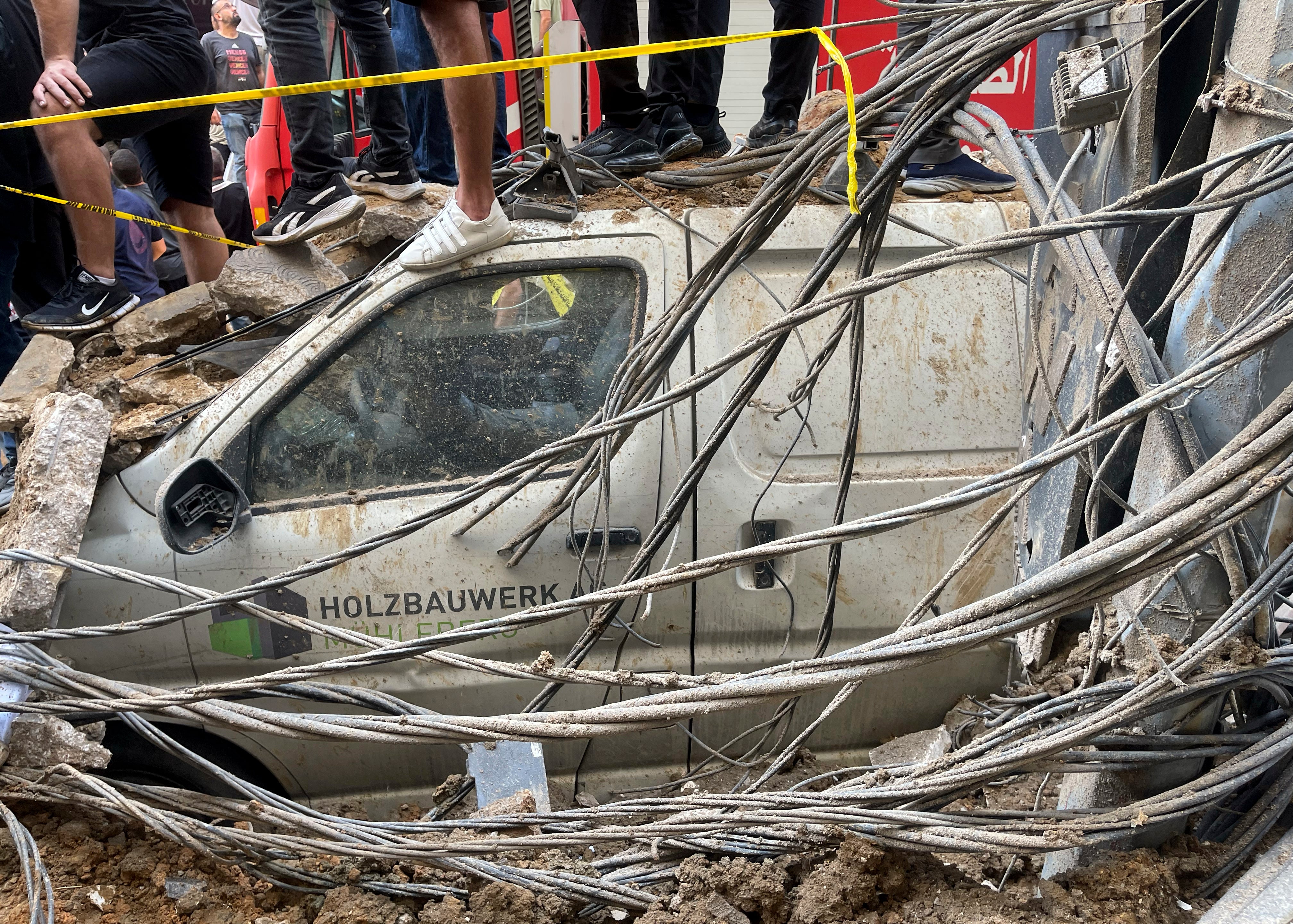 A damaged car after the airstrike hit Beirut