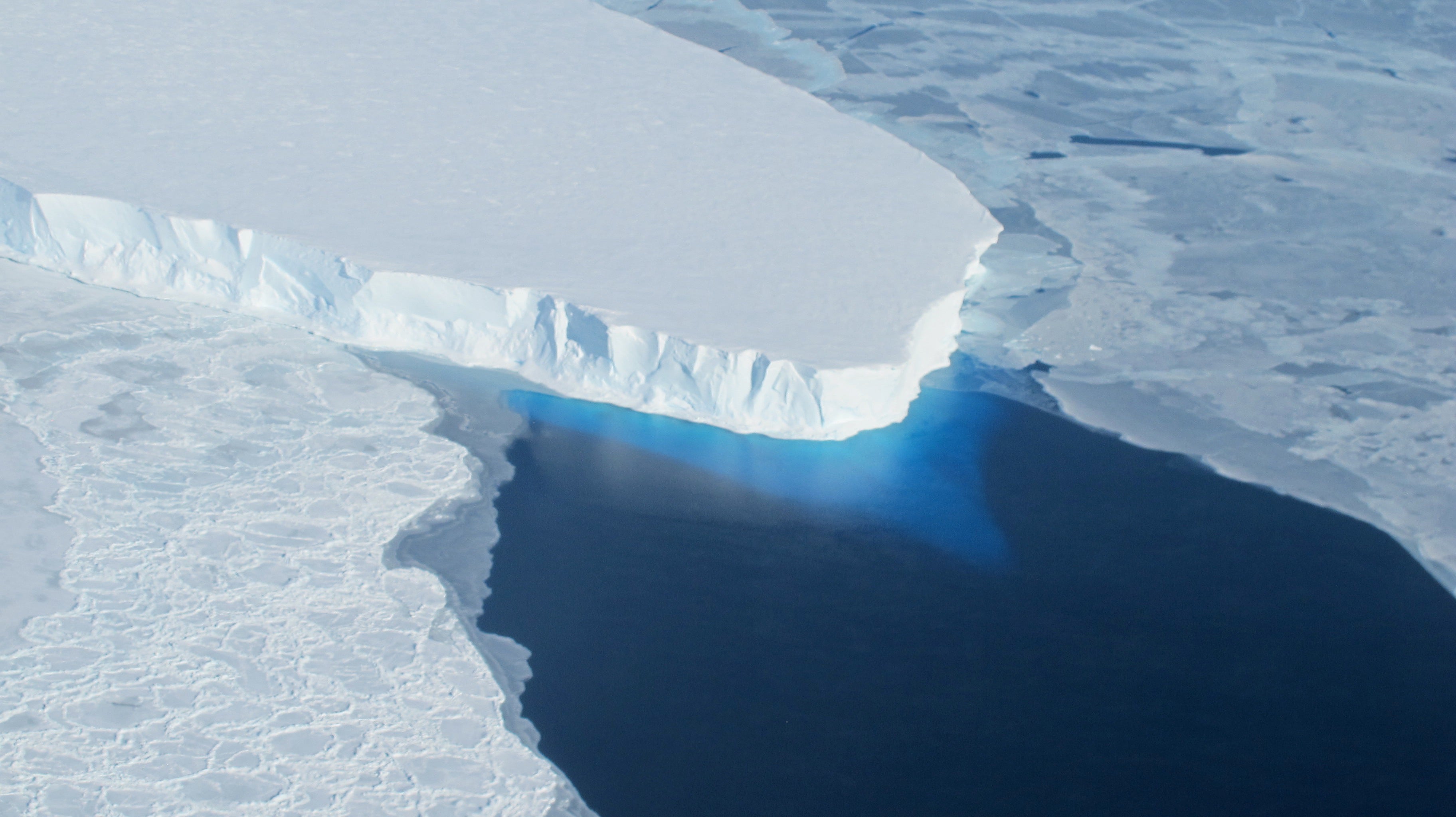 An edge of the Thwaites Glacier meets the frigid, dark blue water of the Southern Ocean. The glacier, which is around the size of Florida, is the widest glacier on Earth. But, due in large part to the planet’s warming, that area is shrinking rapidly.