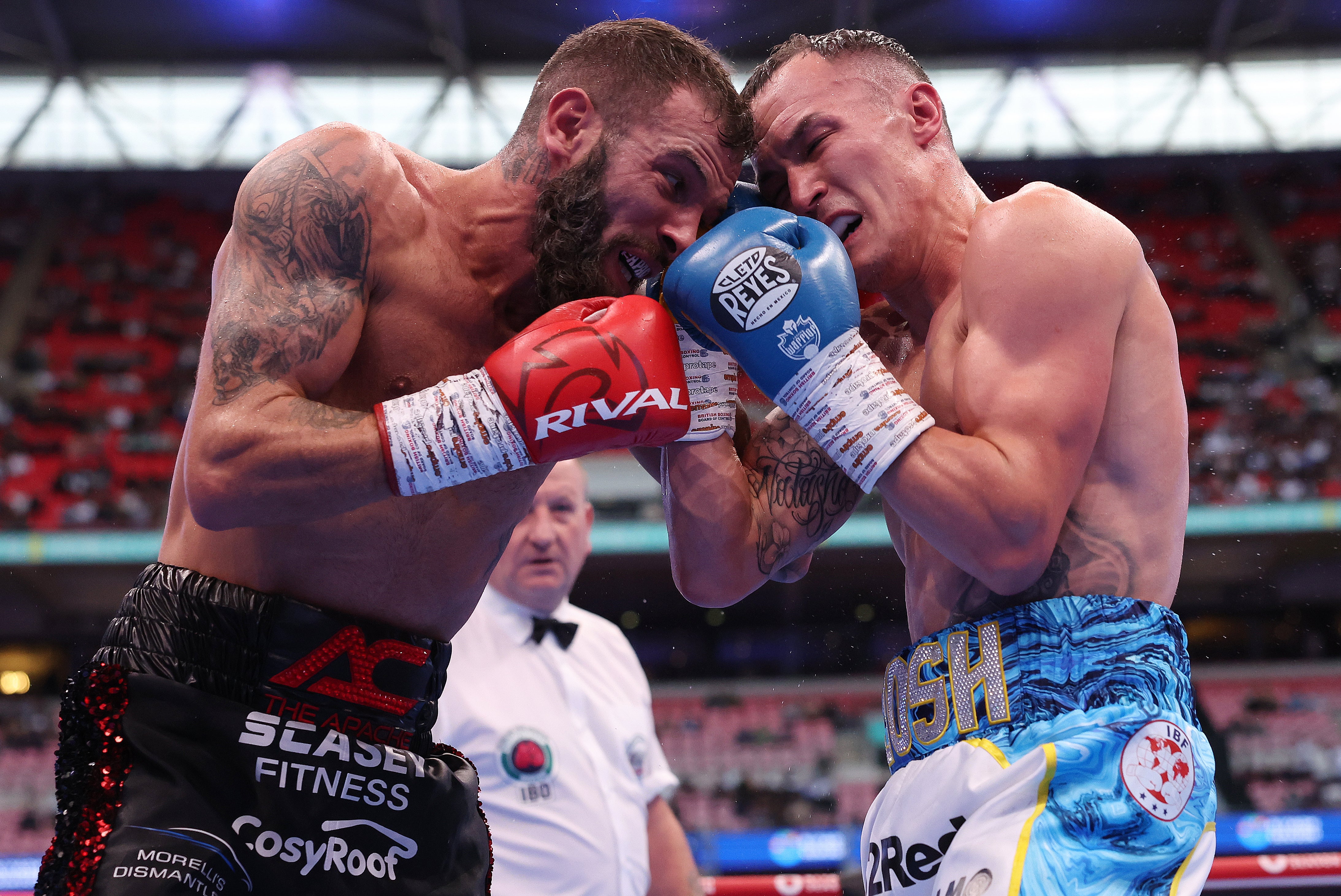 Anthony Cacace and Josh Warrington battle at Wembley Stadium