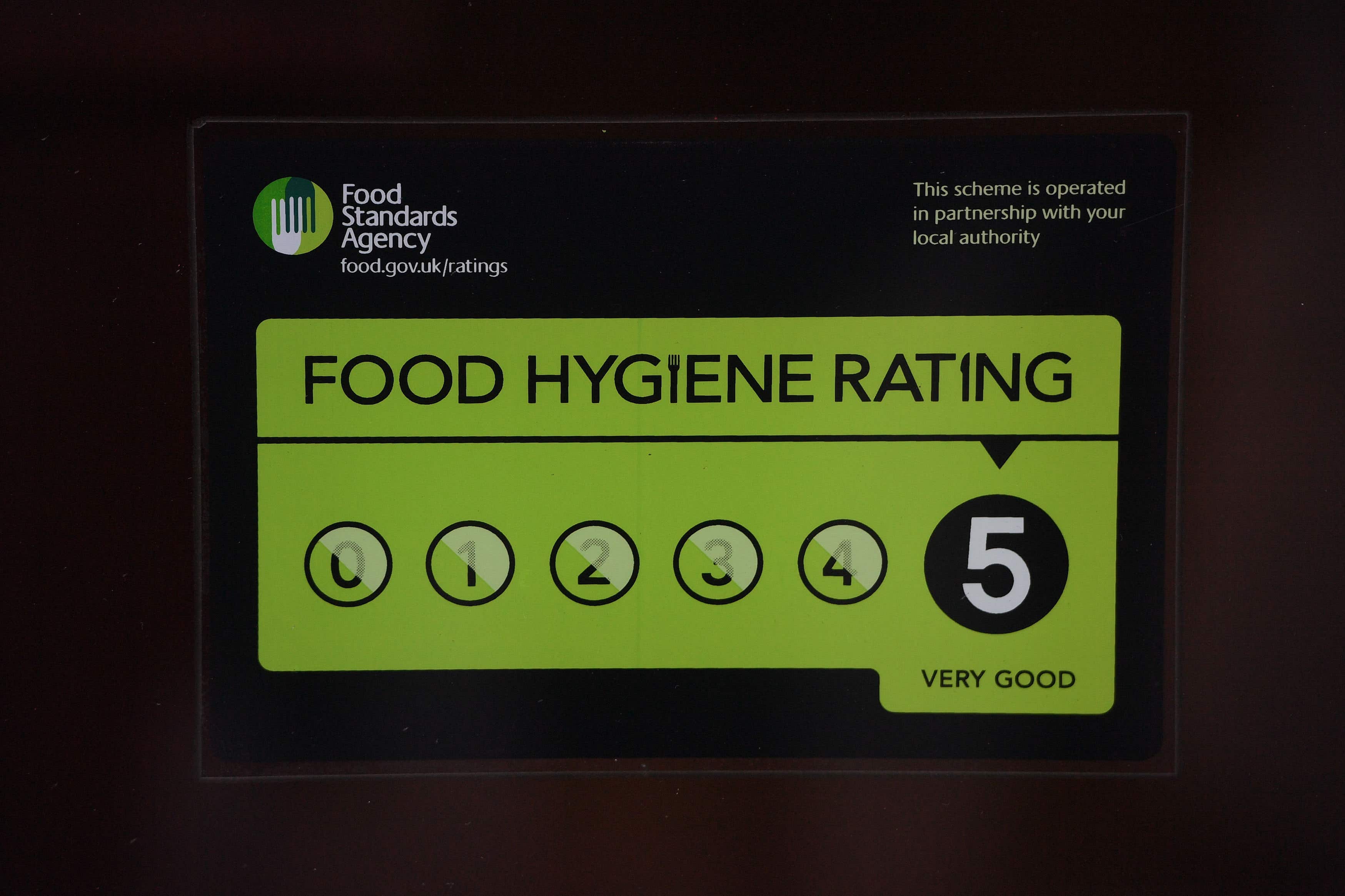 A Food Standards Agency rating sticker on a window of a restaurant in central London (Victoria Jones/PA)