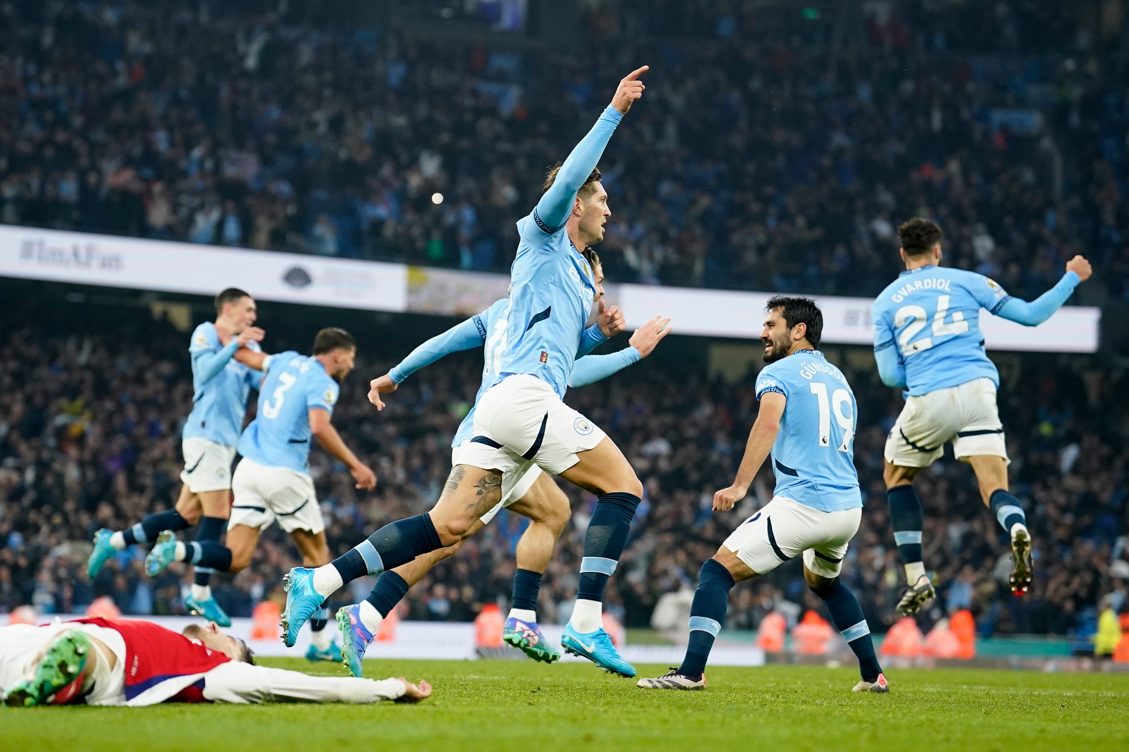 John Stones celebrates after firing home Manchester City’s equaliser