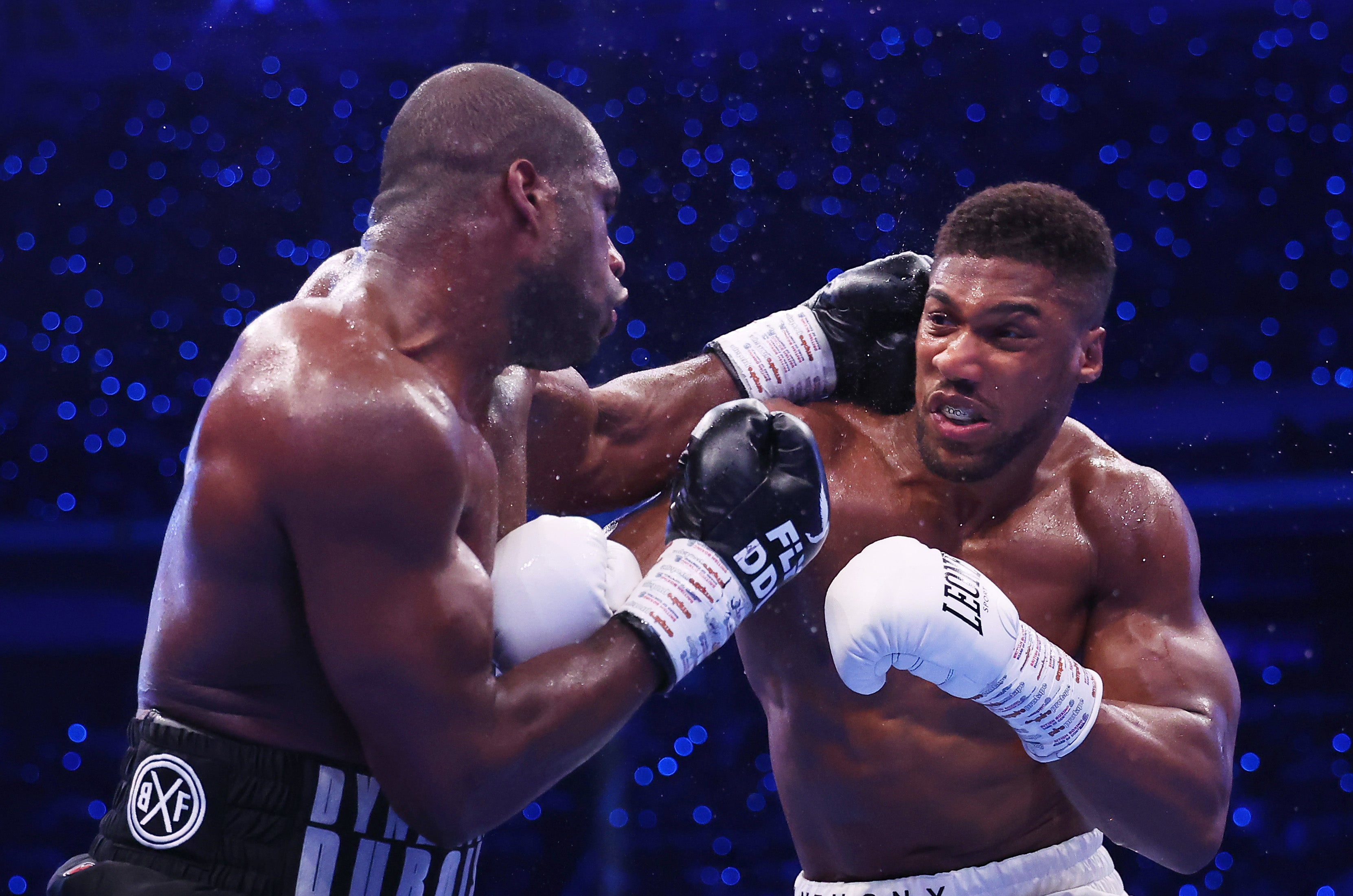 Daniel Dubois punches Anthony Joshua during the IBF World Heavyweight Title fight