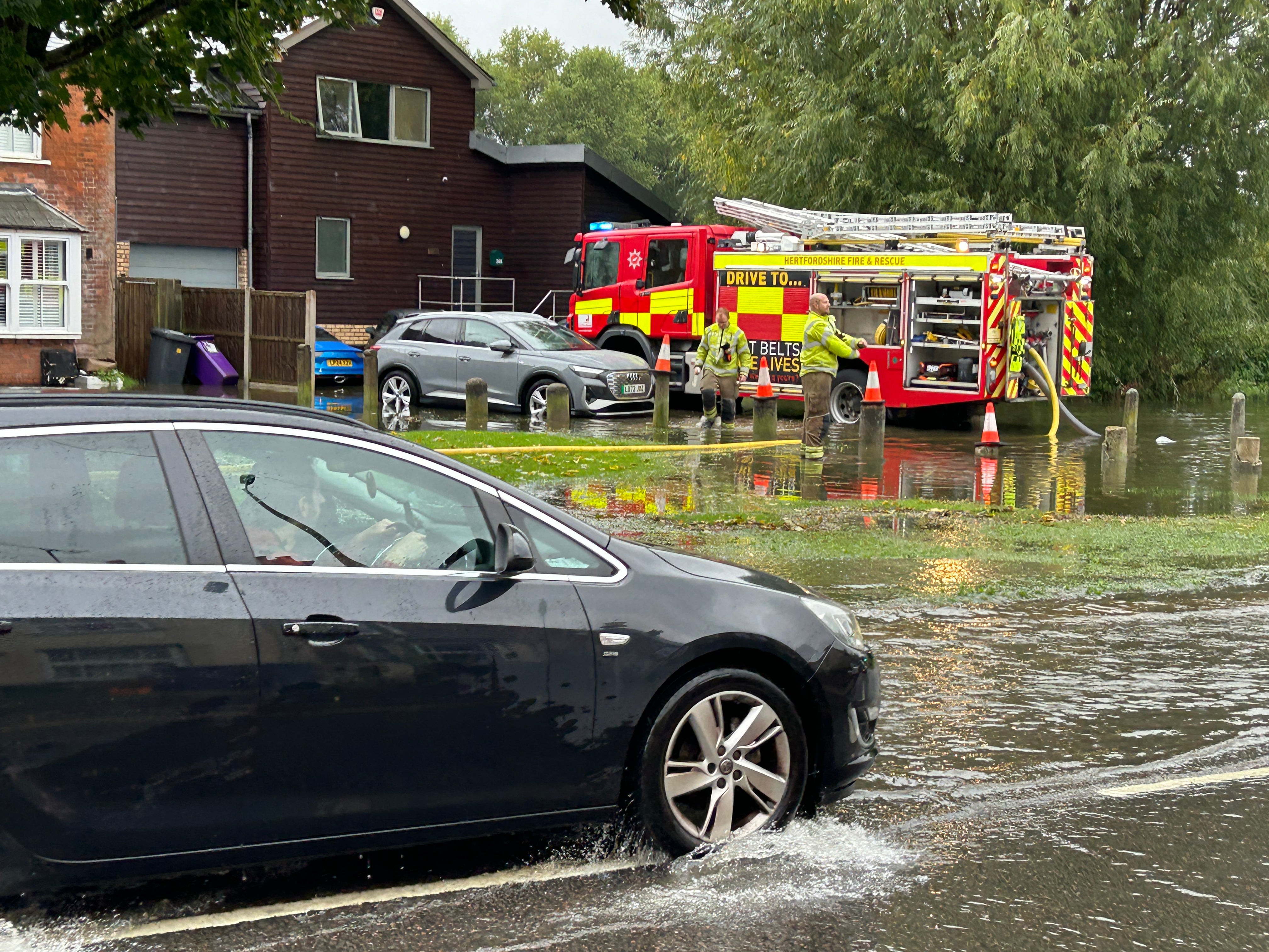 Homes are flooded on Woolgrove Road along the River Purwell in Hitchin