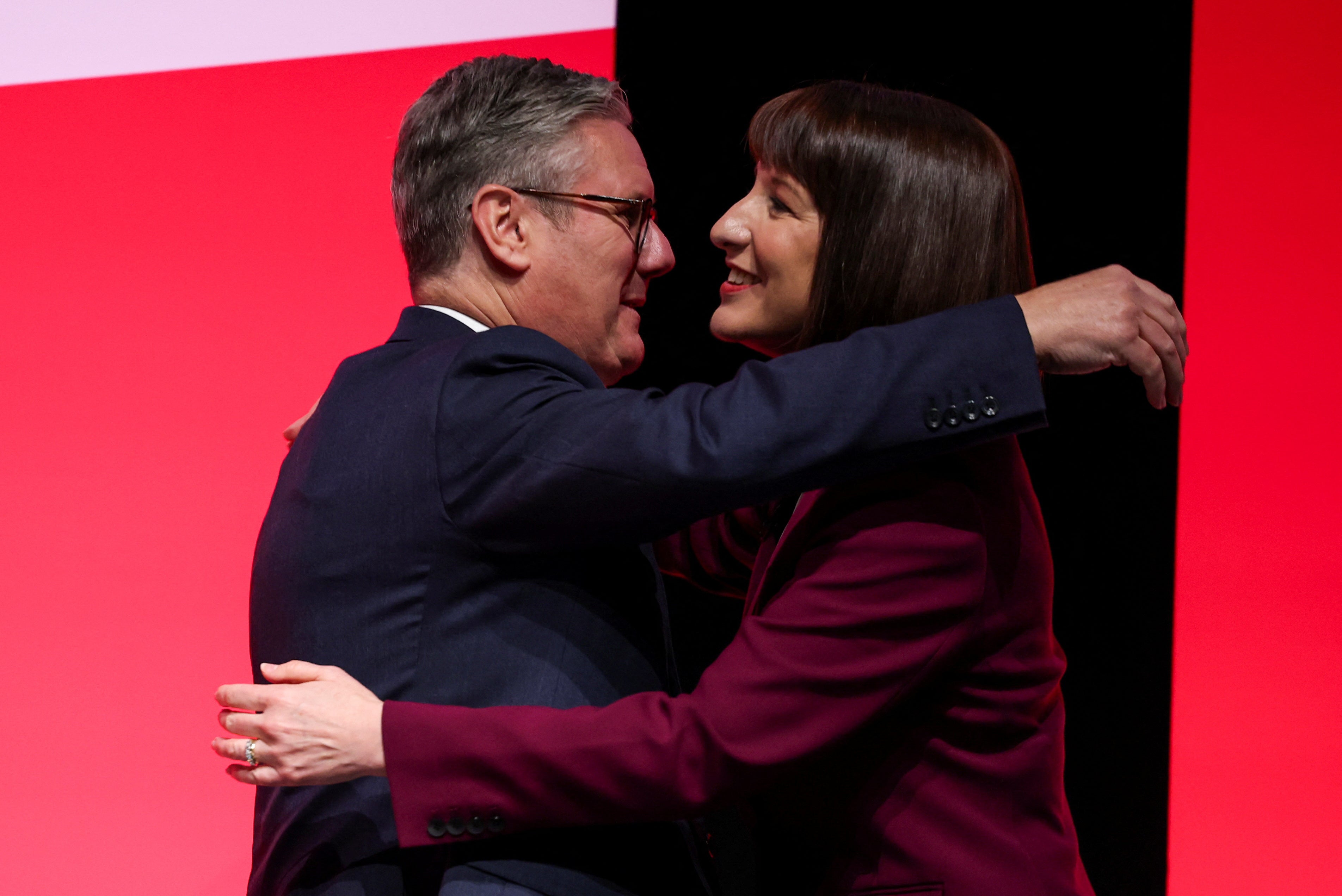 Rachel Reeves and Prime Minister Keir Starmer embrace at Britain's Labour Party's annual conference in Liverpool