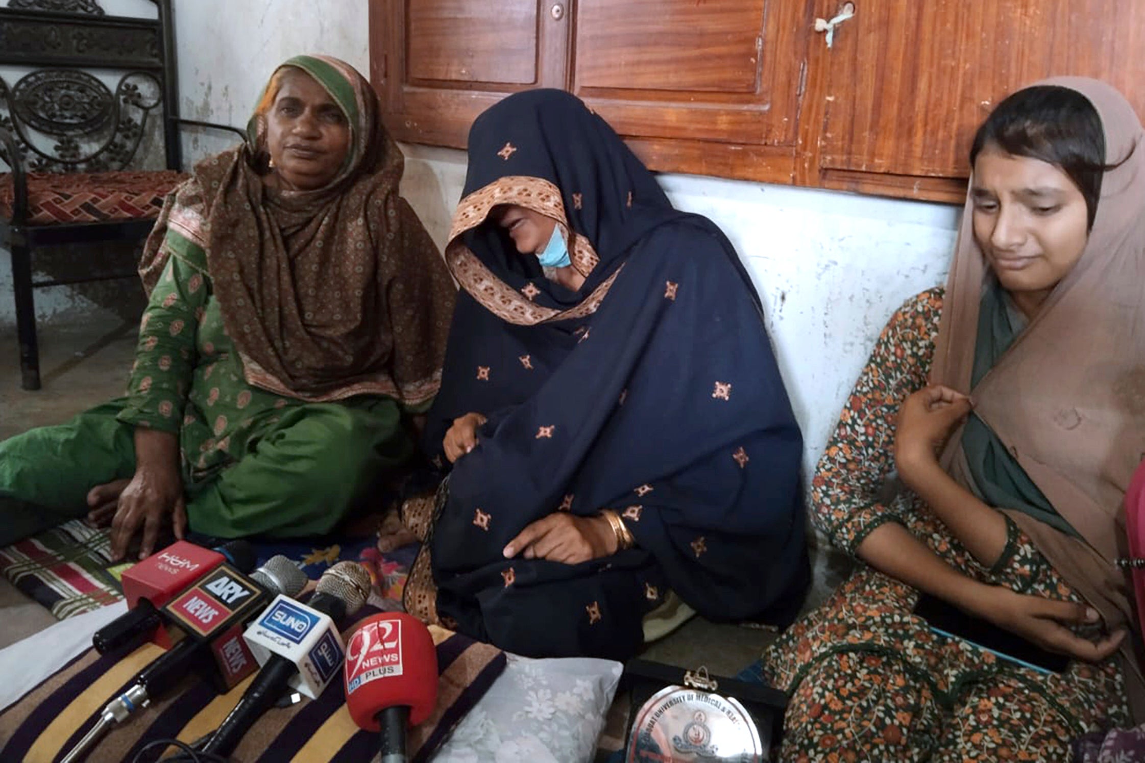 The family of Shah Nawaz, a doctor who was accused of blasphemy, speak to media at their residence in Umerkot. From left: mother Rehmat Kunbhar, wife Niamat Bibi and daughter Hareem Nawaz