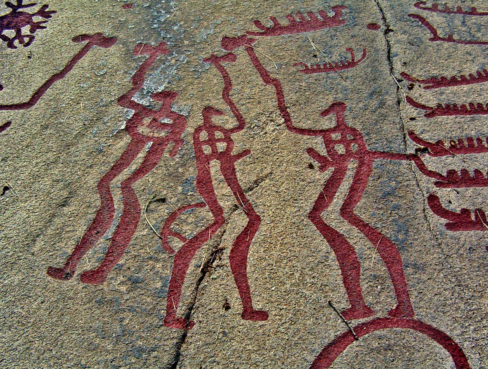 Scandinavian warriors on a rock engraving near Tanumshede in Sweden