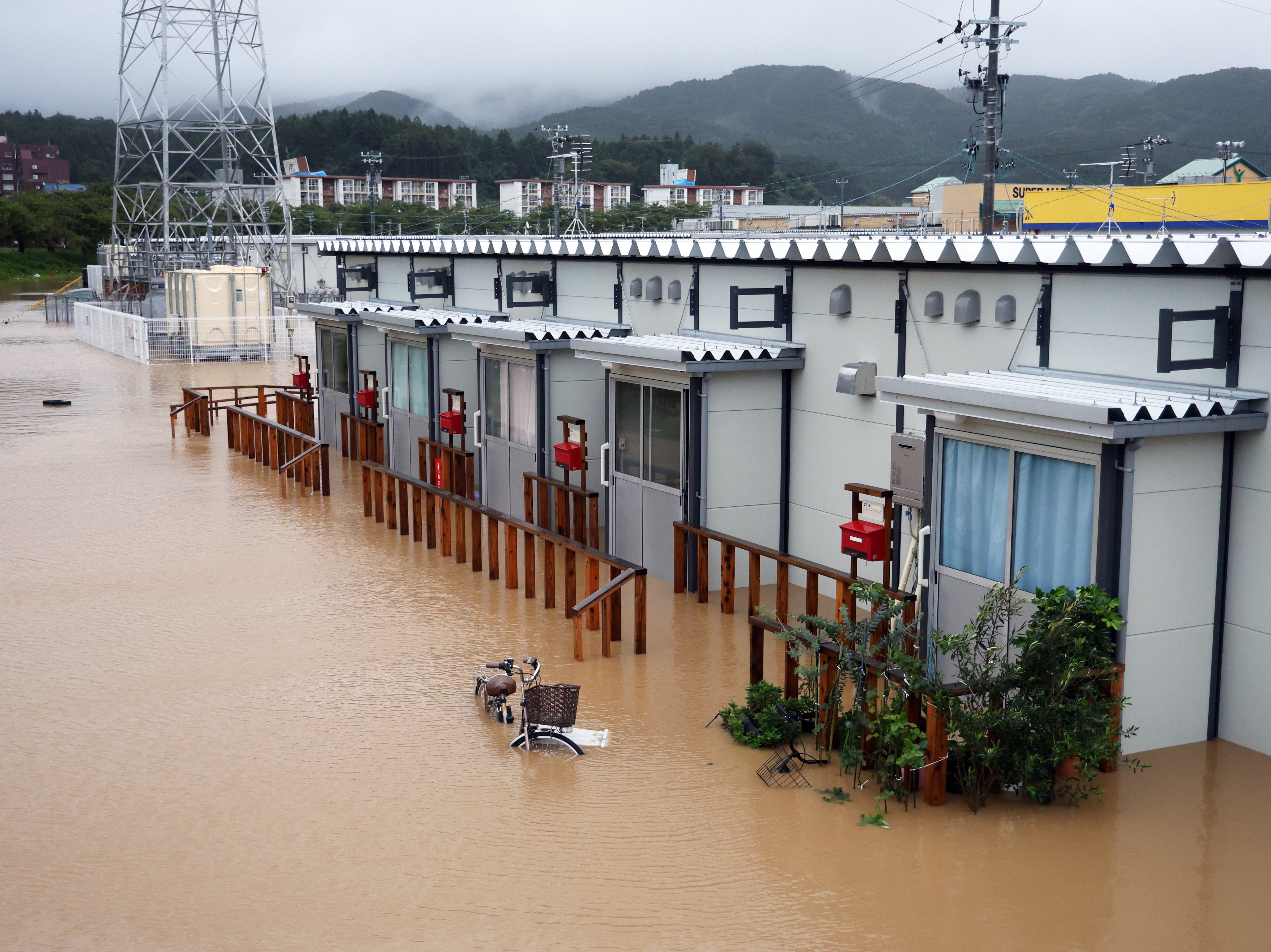 Temporary housing units for people who lost their homes after the New Year’s Day earthquake are flooded following heavy rainfall in Wajima