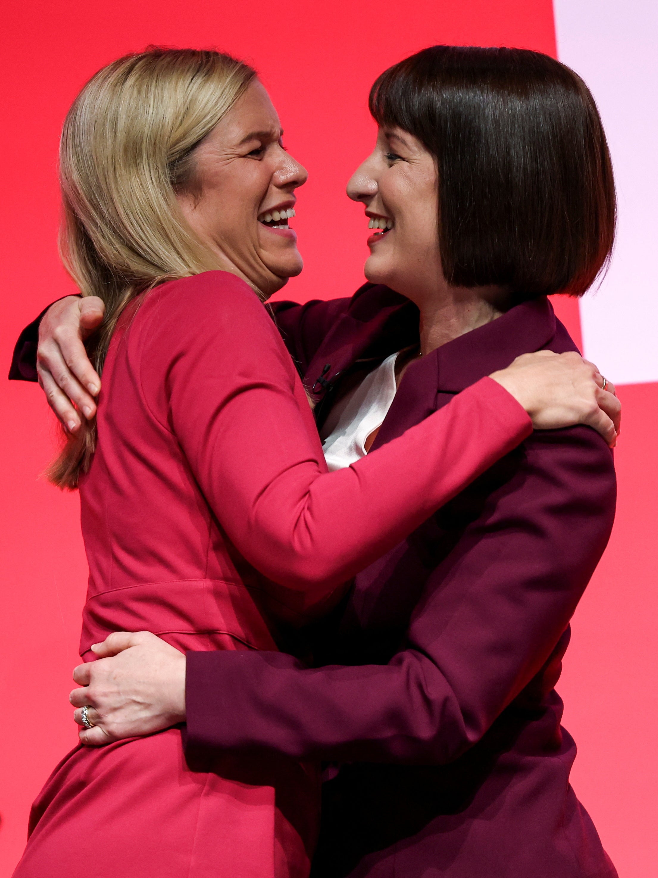 Chancellor Rachel Reeves hugs her sister, Minister without Portfolio Ellie Reeves, after speaking on stage at Britain's Labour Party's annual conference in Liverpool