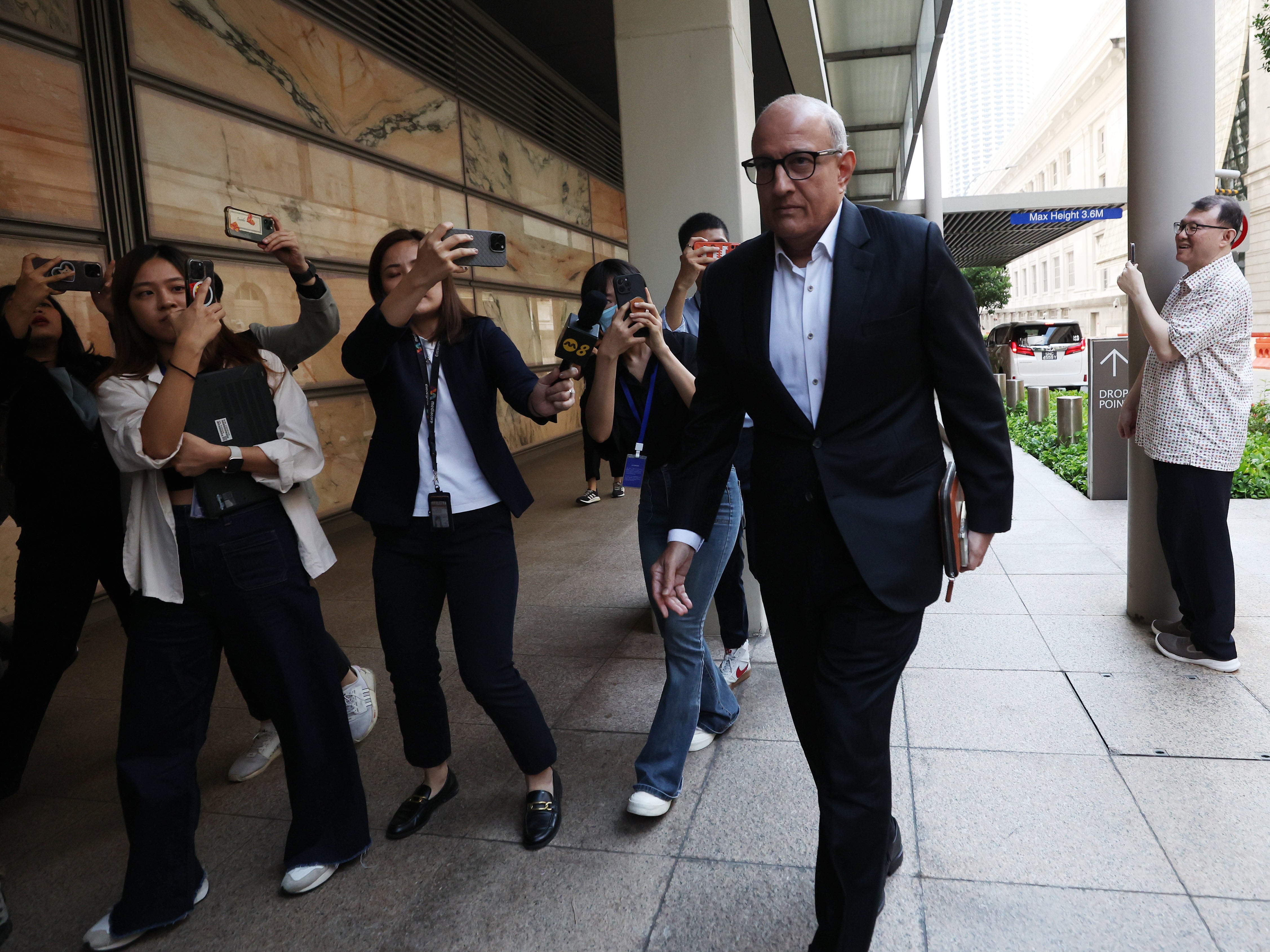 Singapore’s former Minister of Transport S Iswaran (C) arrives for his trial at the High Court in Singapore, 24 September 2024