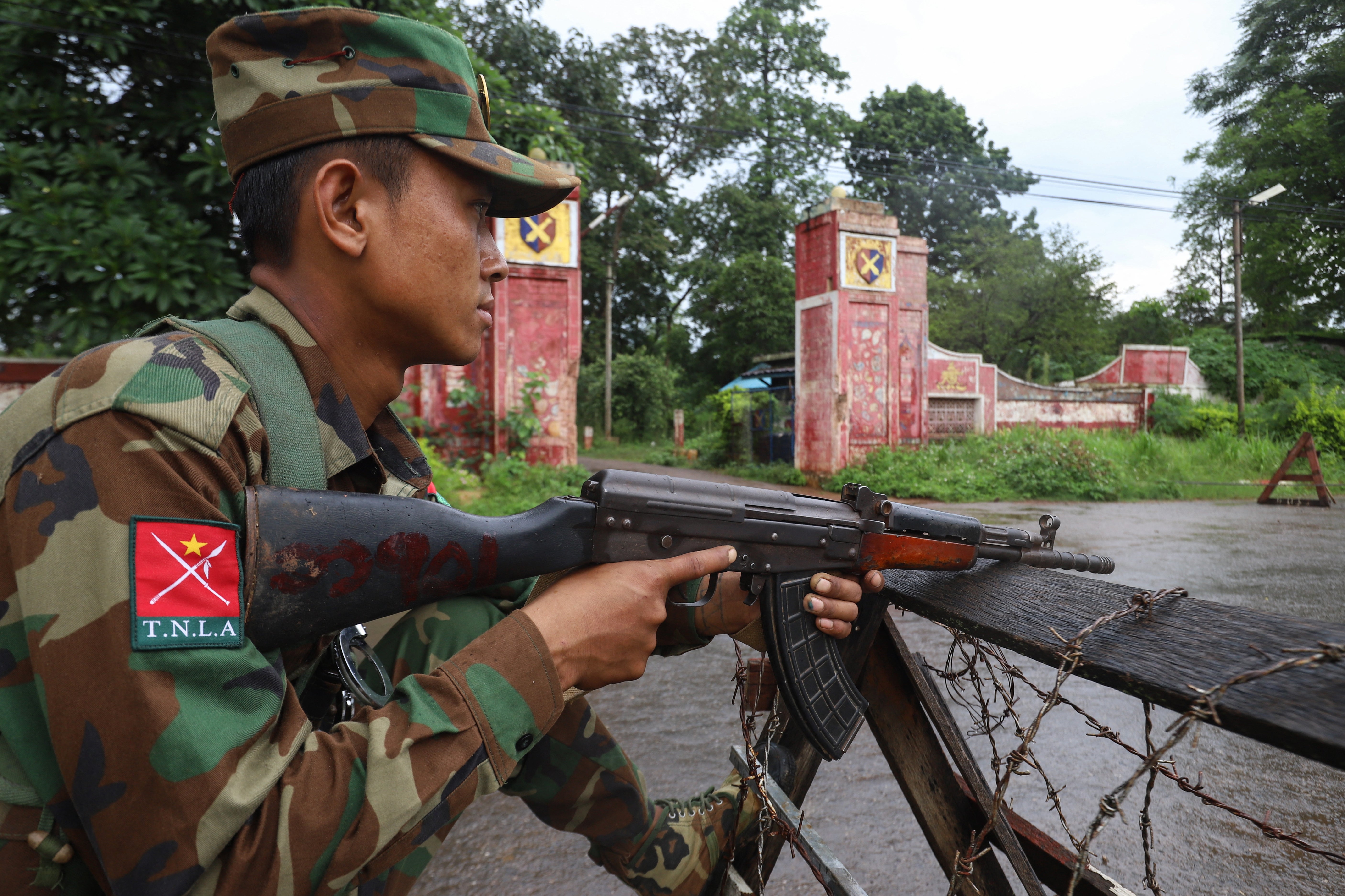 A member of the group Ta’ang National Liberation Army (TNLA) keeping watch at a checkpoint in the town of Kyaukme in Myanmar’s northern Shan state