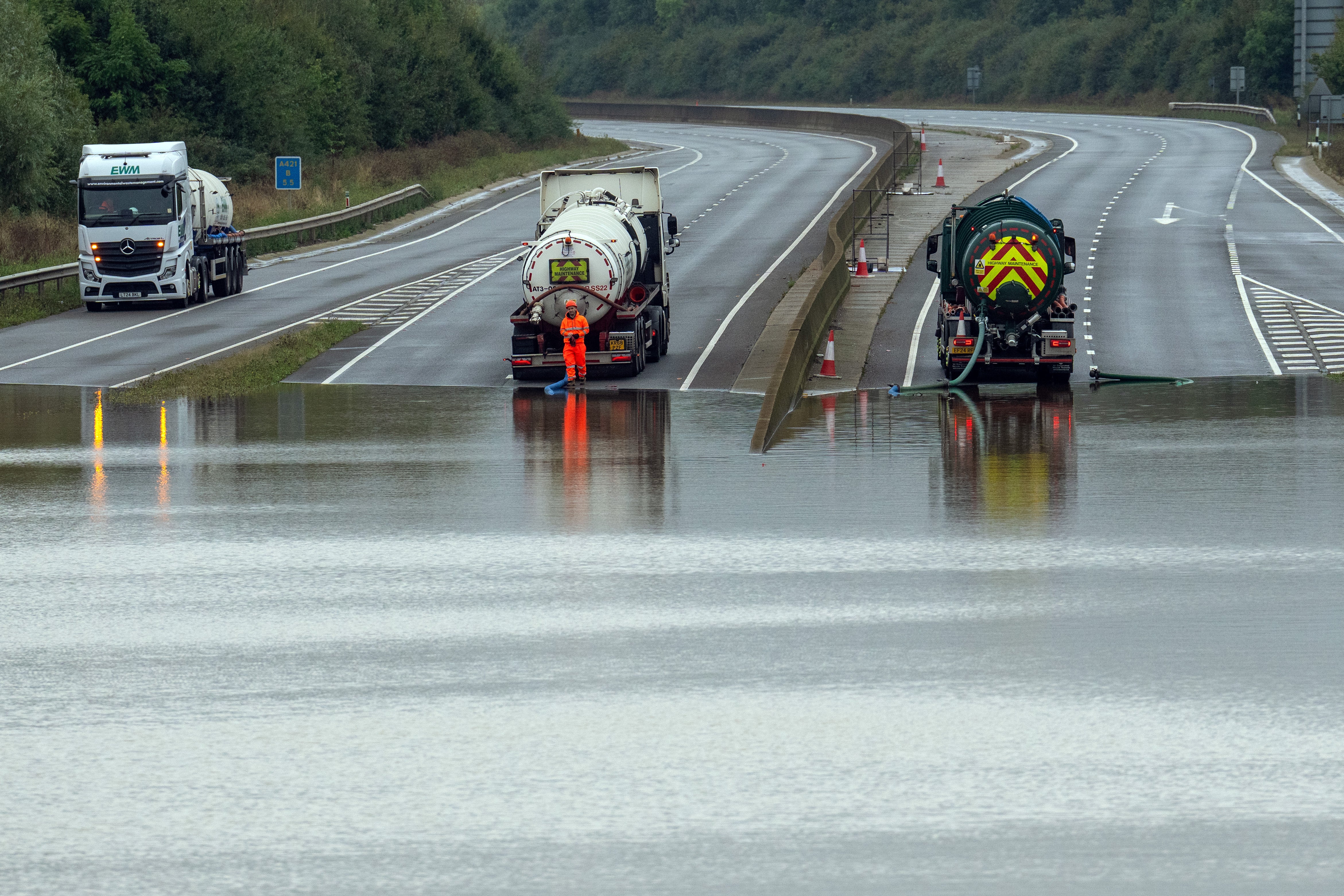 Tanker trucks work to remove floodwater