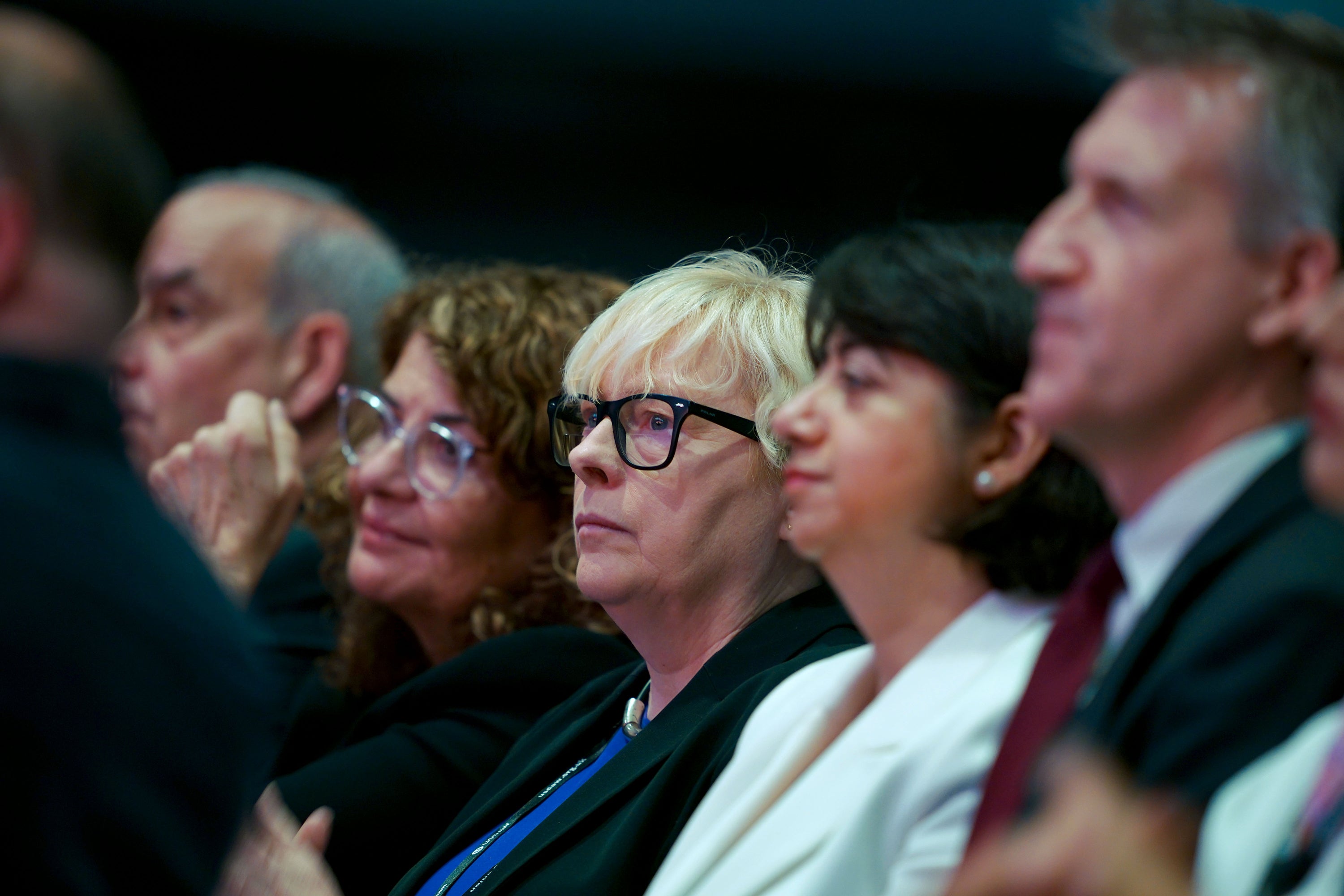 Minister of State at the Home Office Dame Angela Eagle (centre)MP for Wallasey, listens as Home Secretary Yvette Cooper delivers a speech