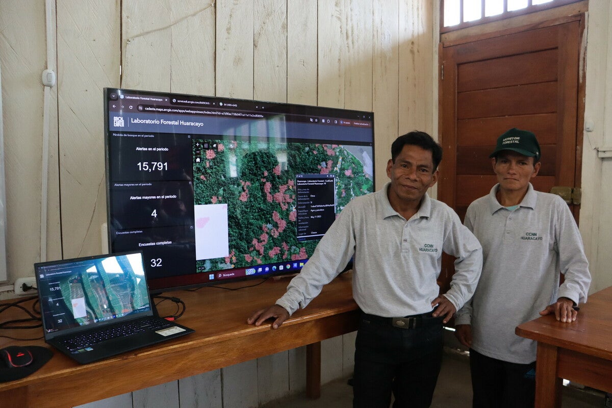 Forest Monitors Abelardo and Ubaldo, who hail from Indigenous communities in Peru, pose at the Rainforest Lab in Huaracayo