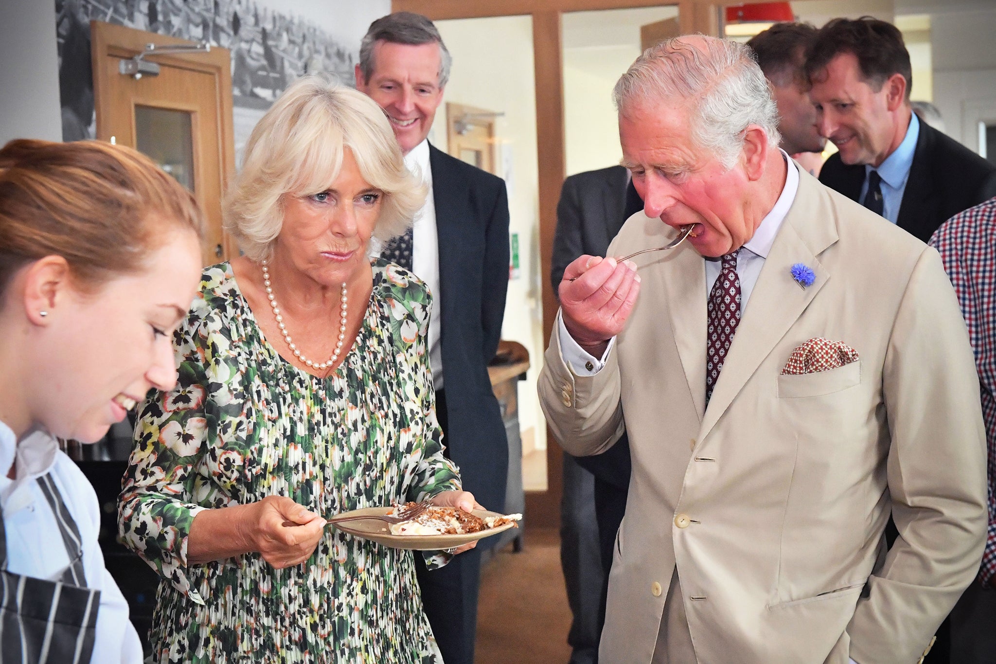 The King and Queen eating carrot cake to celebrate her 71st birthday during a visit to the Isles of Scilly in 2019