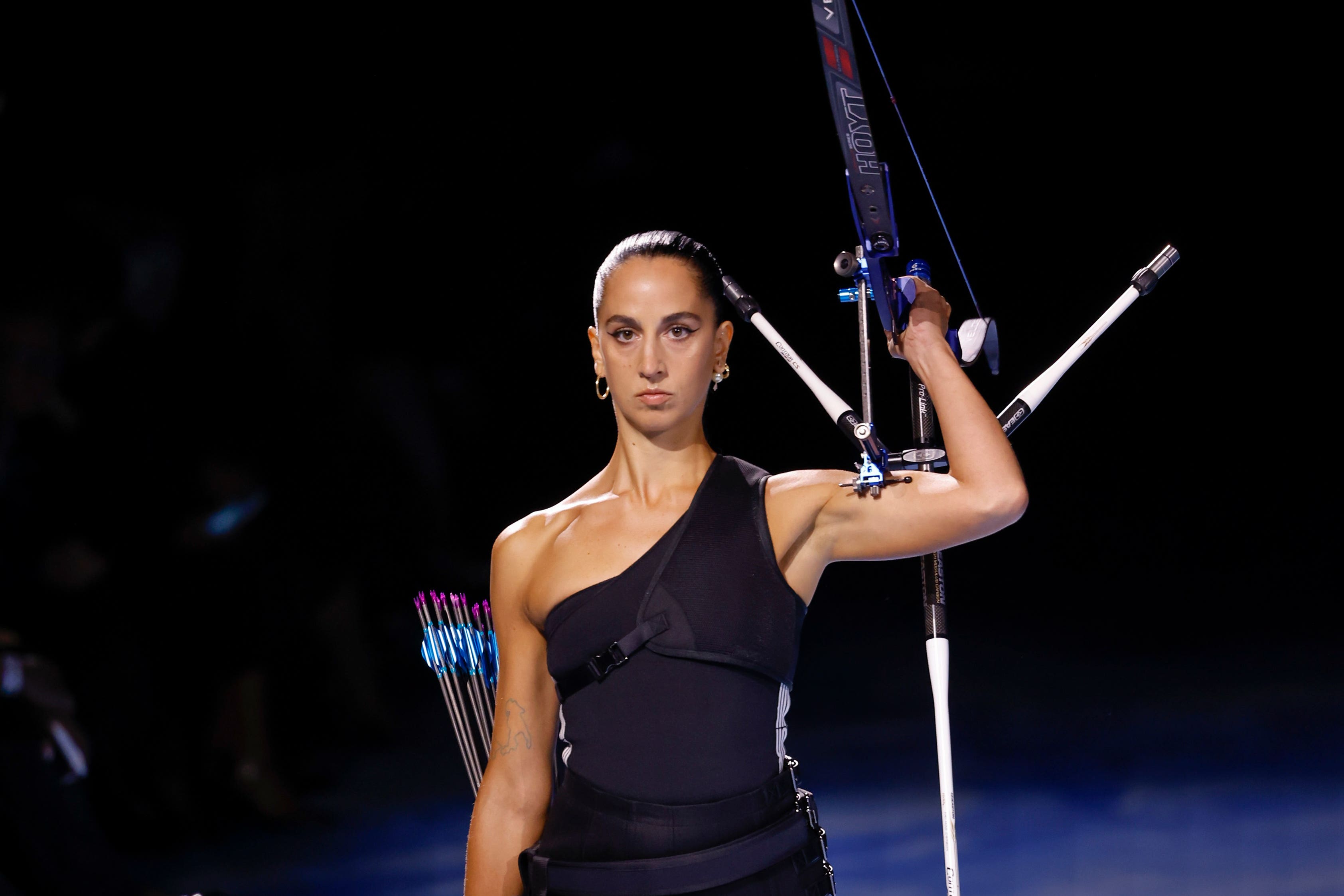 Dior showcased live archery as an homage to female strength (Vianney Le Caer/AP)