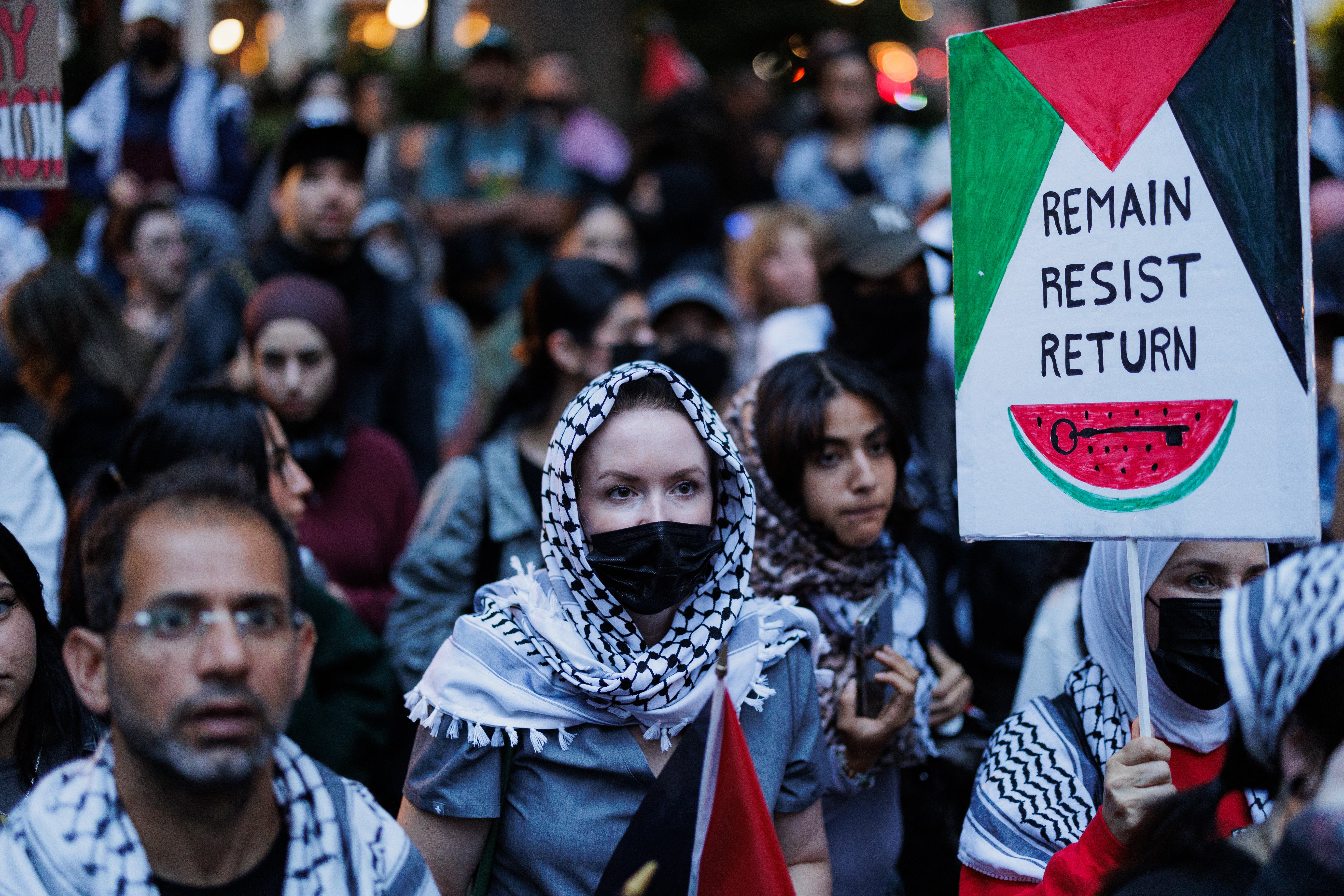 People participate in a ‘Flood Manhattan for Lebanon’ protest with signs at Madison Square Park in New York