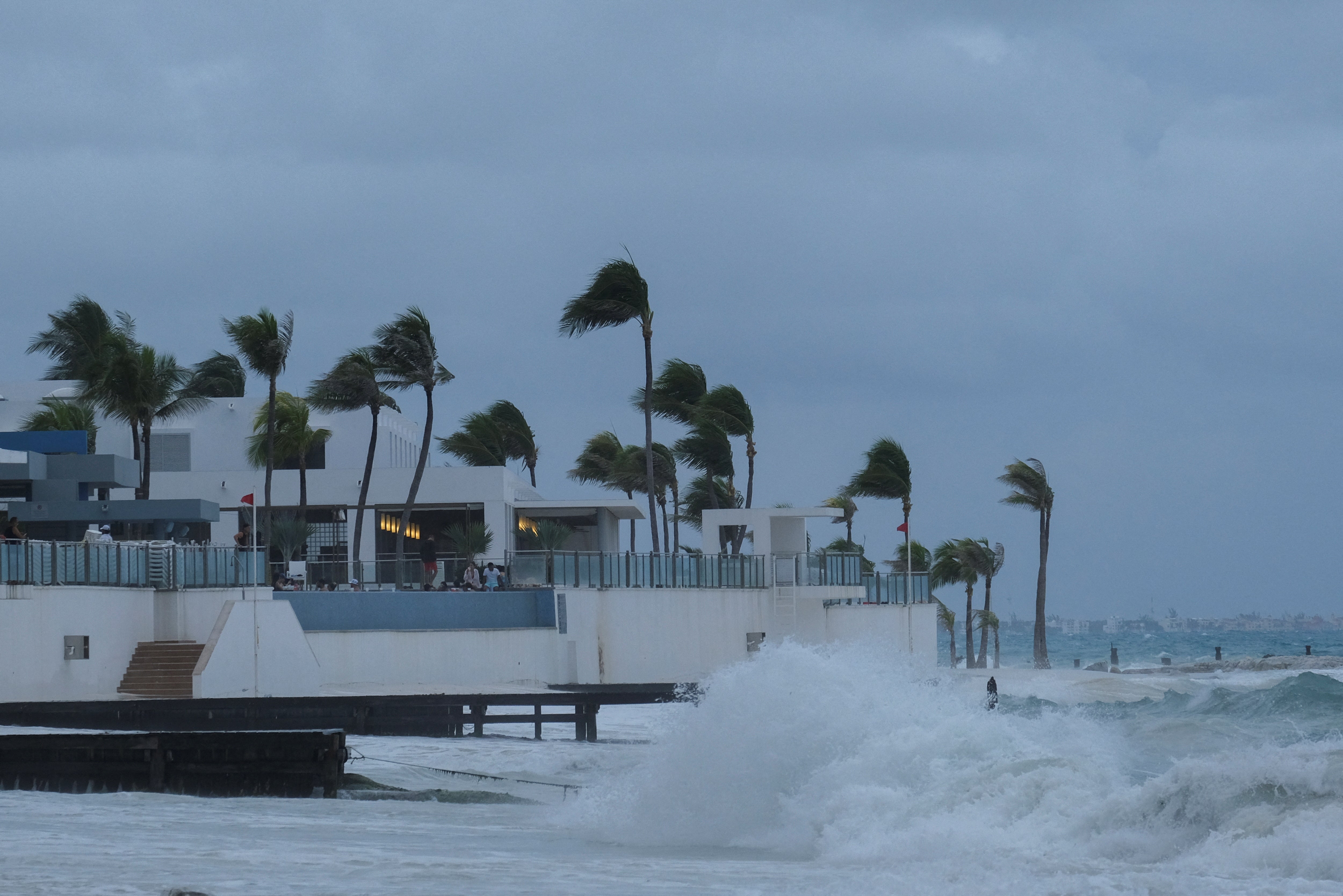 Wind batters palm trees and strong waves hit a beach in Cancún, Mexico thanks to Storm Helene. The hurricane is expected to make landfall in Florida on Thursday