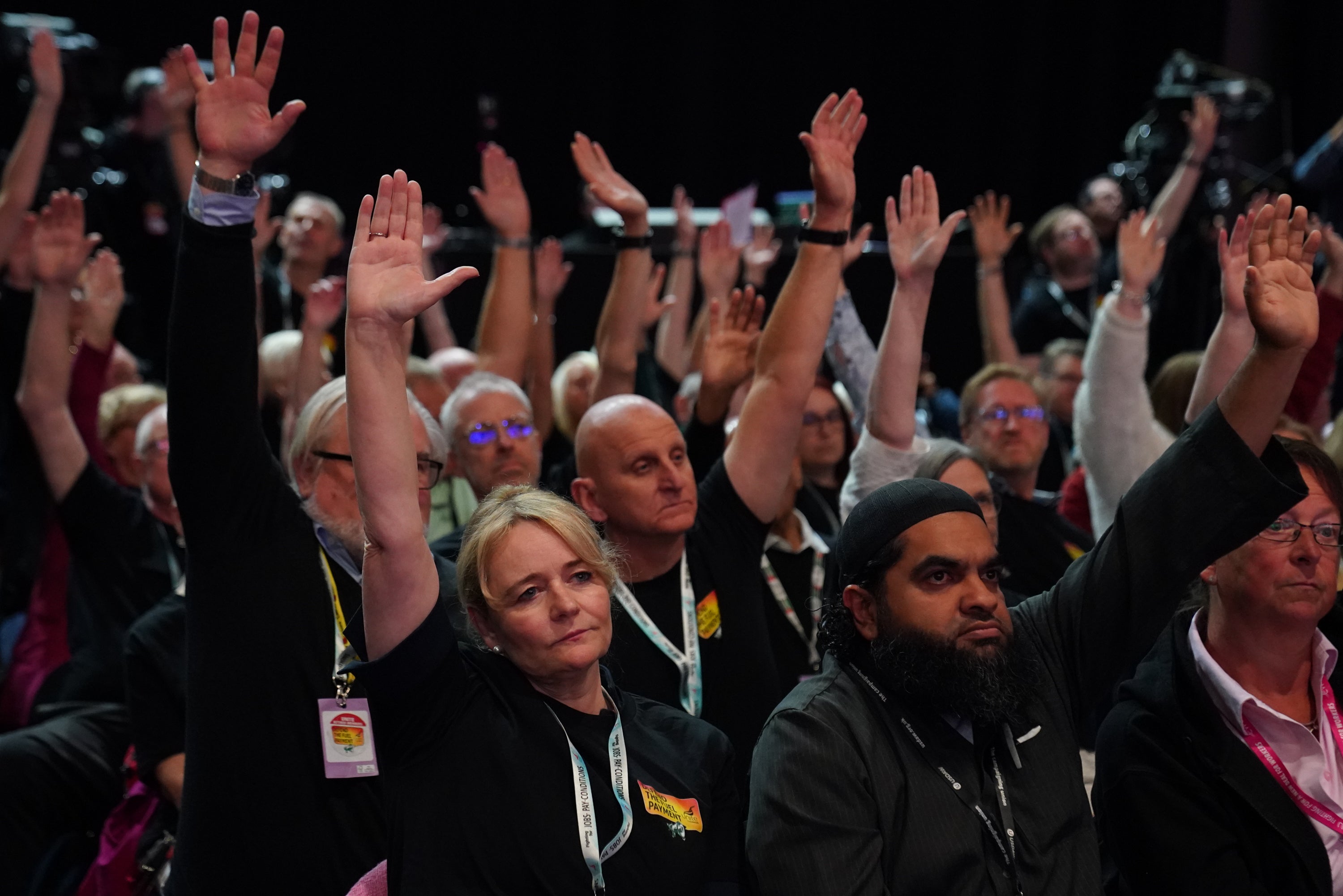 Unite general secretary Sharon Graham (front left) votes with other delegates in favour of a motion demanding Starmer scraps his cuts to the winter fuel payment