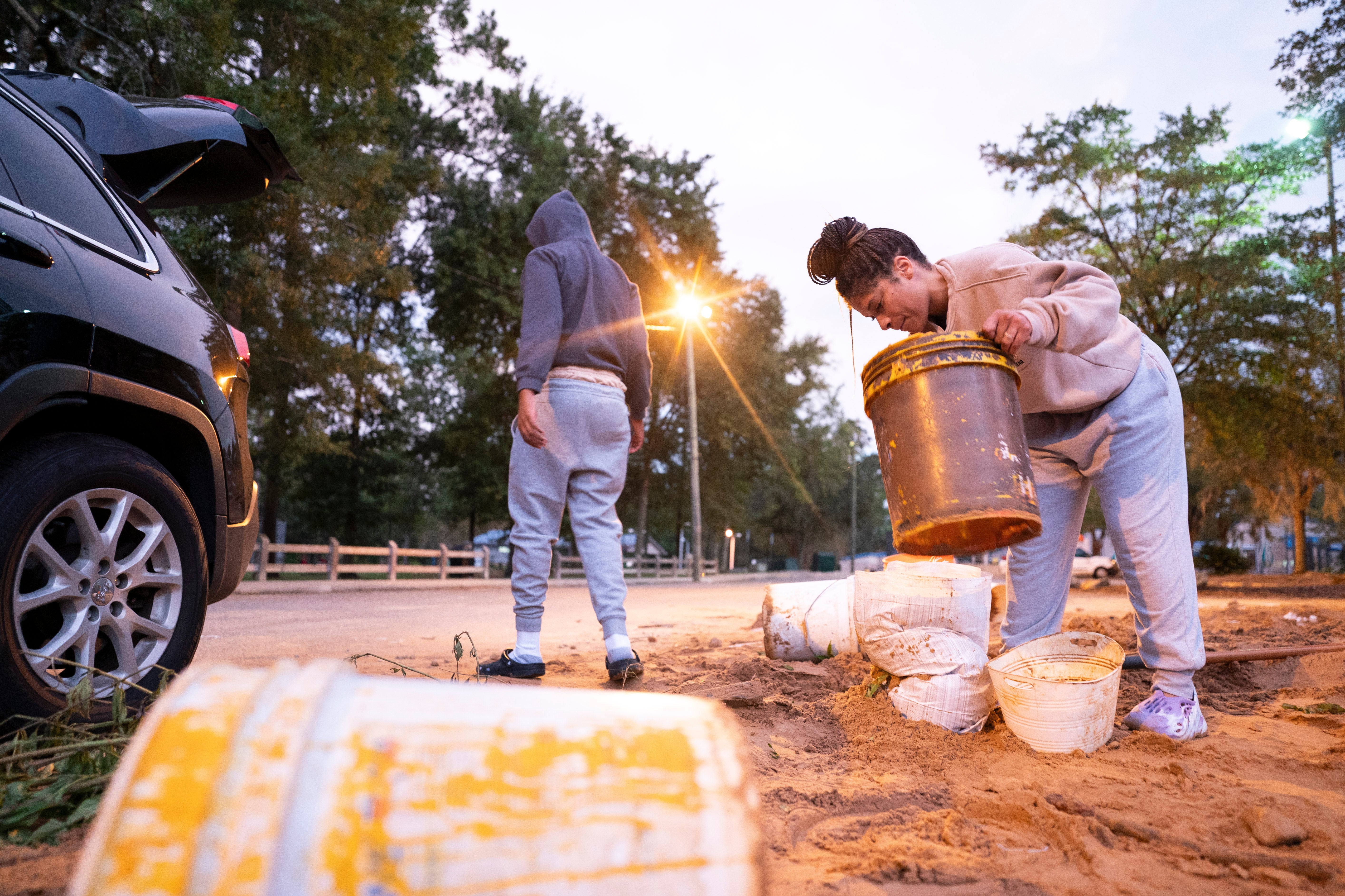 People bag sand in preparation for possible flooding on Wednesday in Tallahassee, Florida