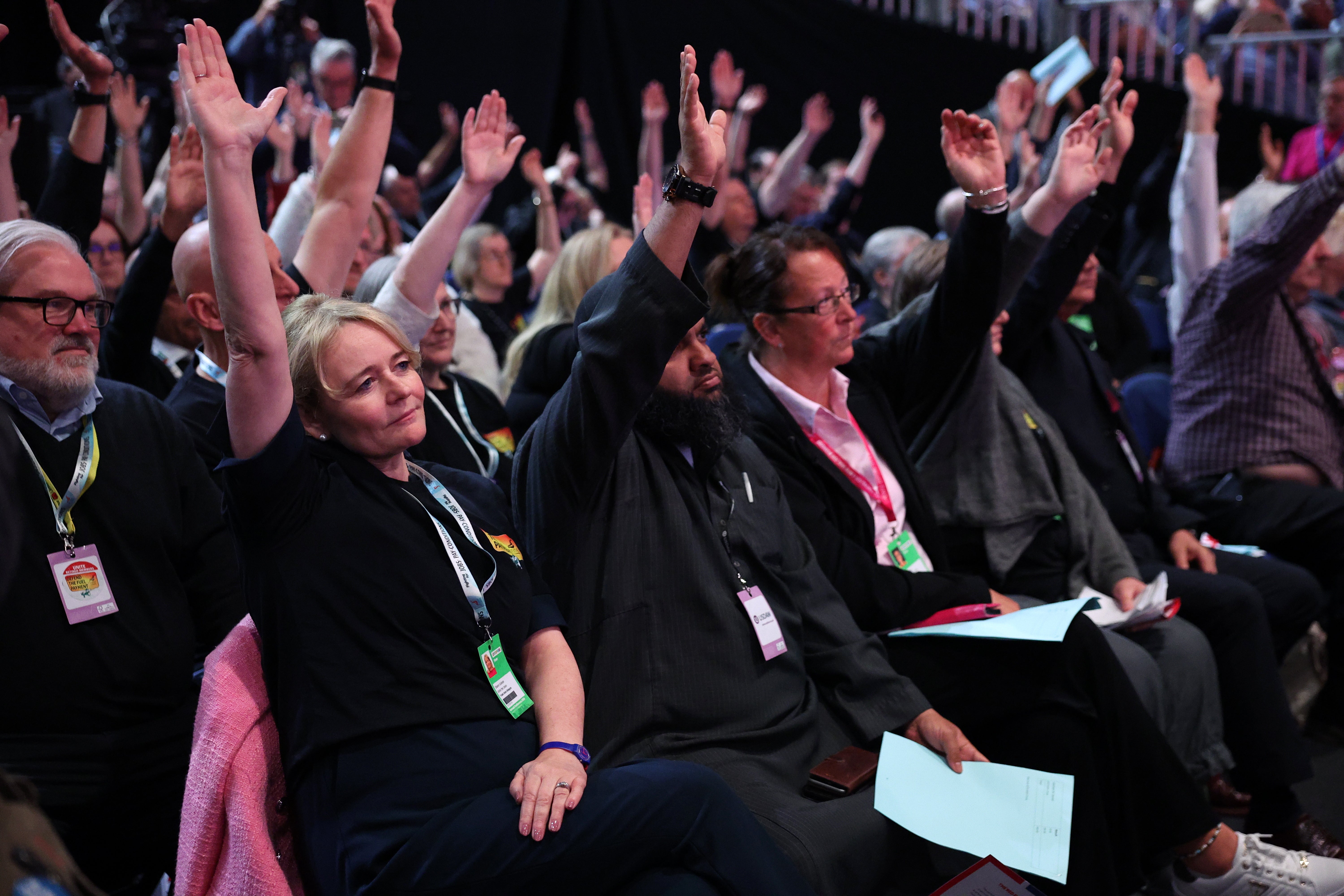 Sharon Graham (L), General Secretary of the Unite union, votes alongside delegates against the removal of the winter fuel allowance to some pensioners