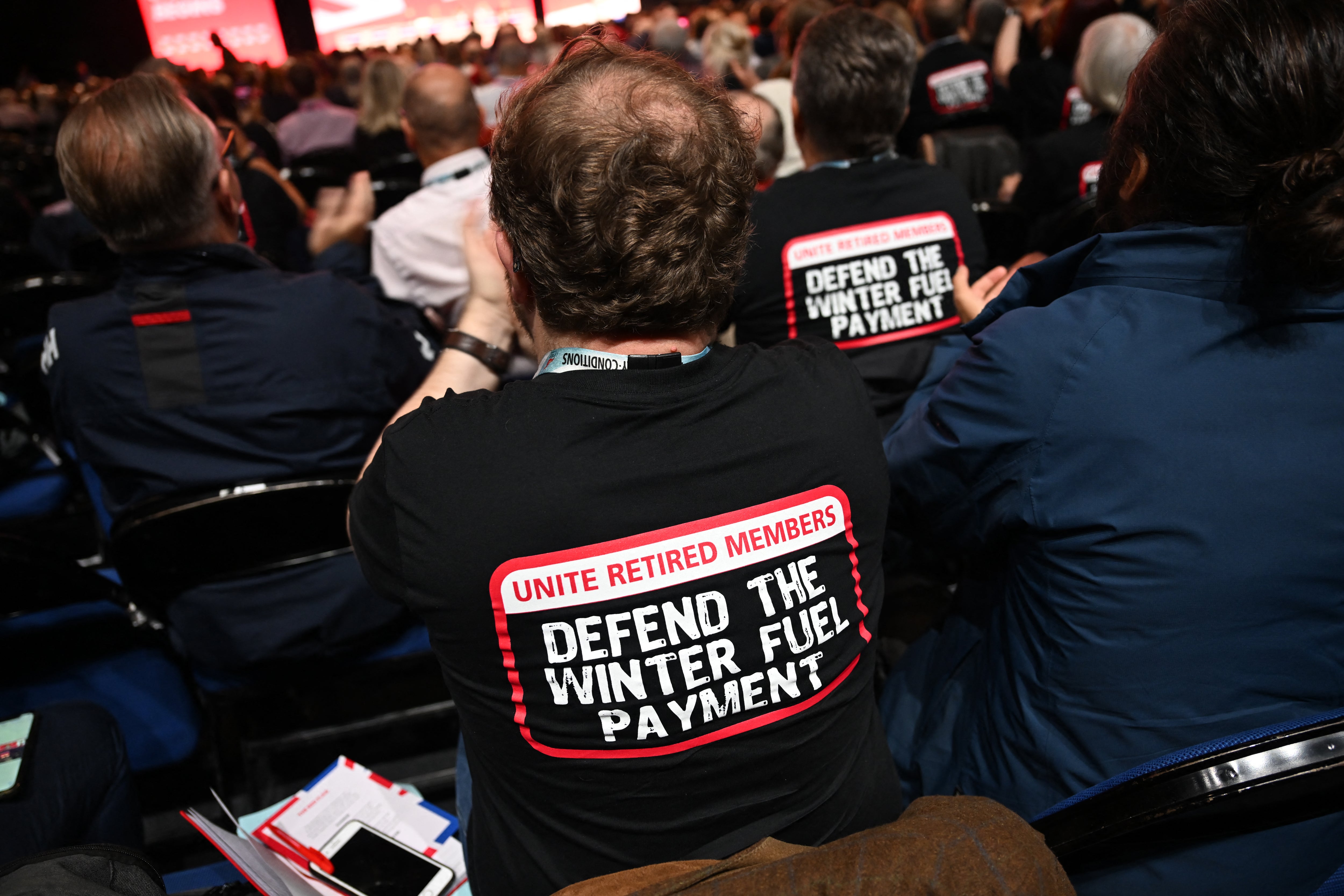 Unite Union members cheer as Unite Union General Secretary Sharon Graham speaks on stage