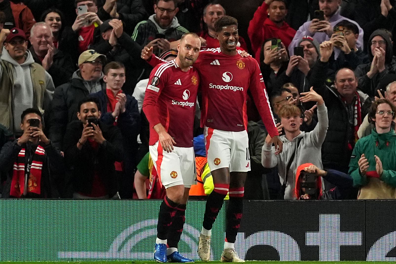 Christian Eriksen, left, celebrates his goal (Martin Rickett/PA)