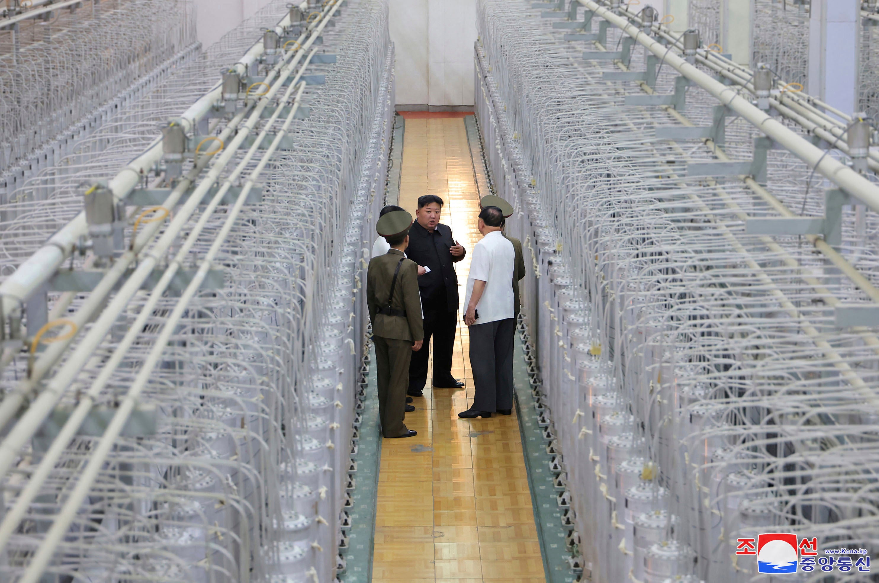 This undated photo provided on 13 Sept 2024 by the North Korean government shows its leader Kim Jong-un, centre, on an inspecting visit at what they say is an institute of nuclear weapons and a facility for nuclear materials at an undisclosed location in North Korea