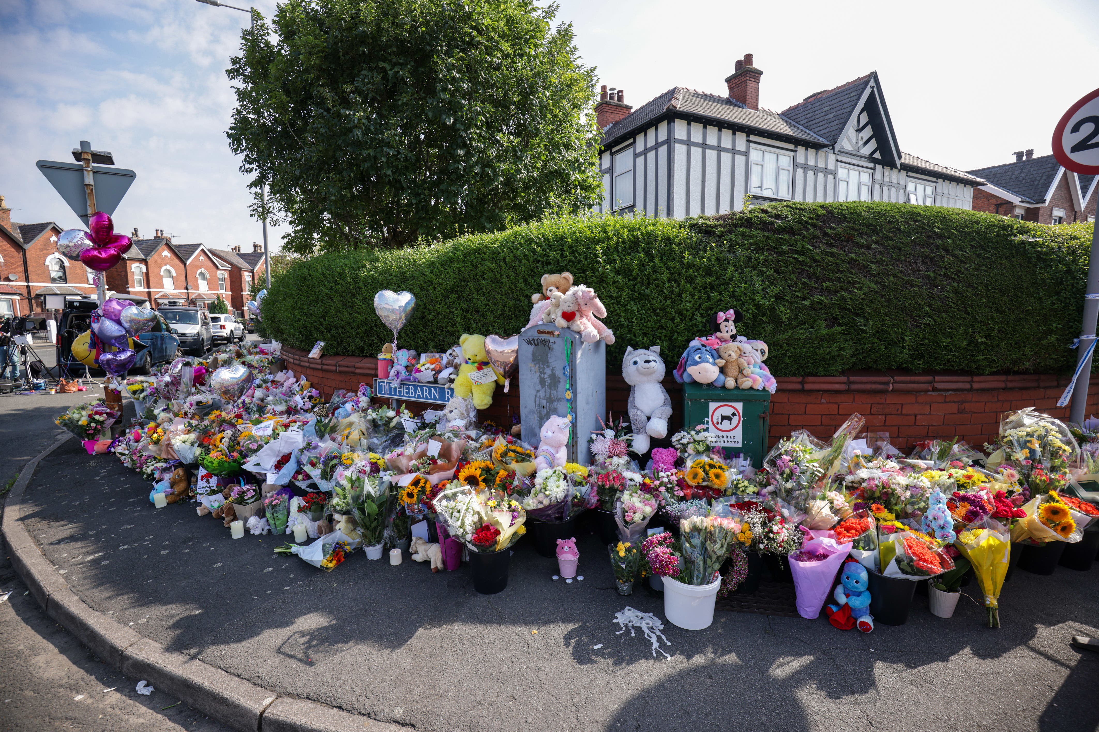 Floral tributes on the junction of Tithebarn Road and Hart Street in Southport, near the scene where three children were fatally stabbed at a Taylor Swift-themed holiday club (James Speakman/PA)