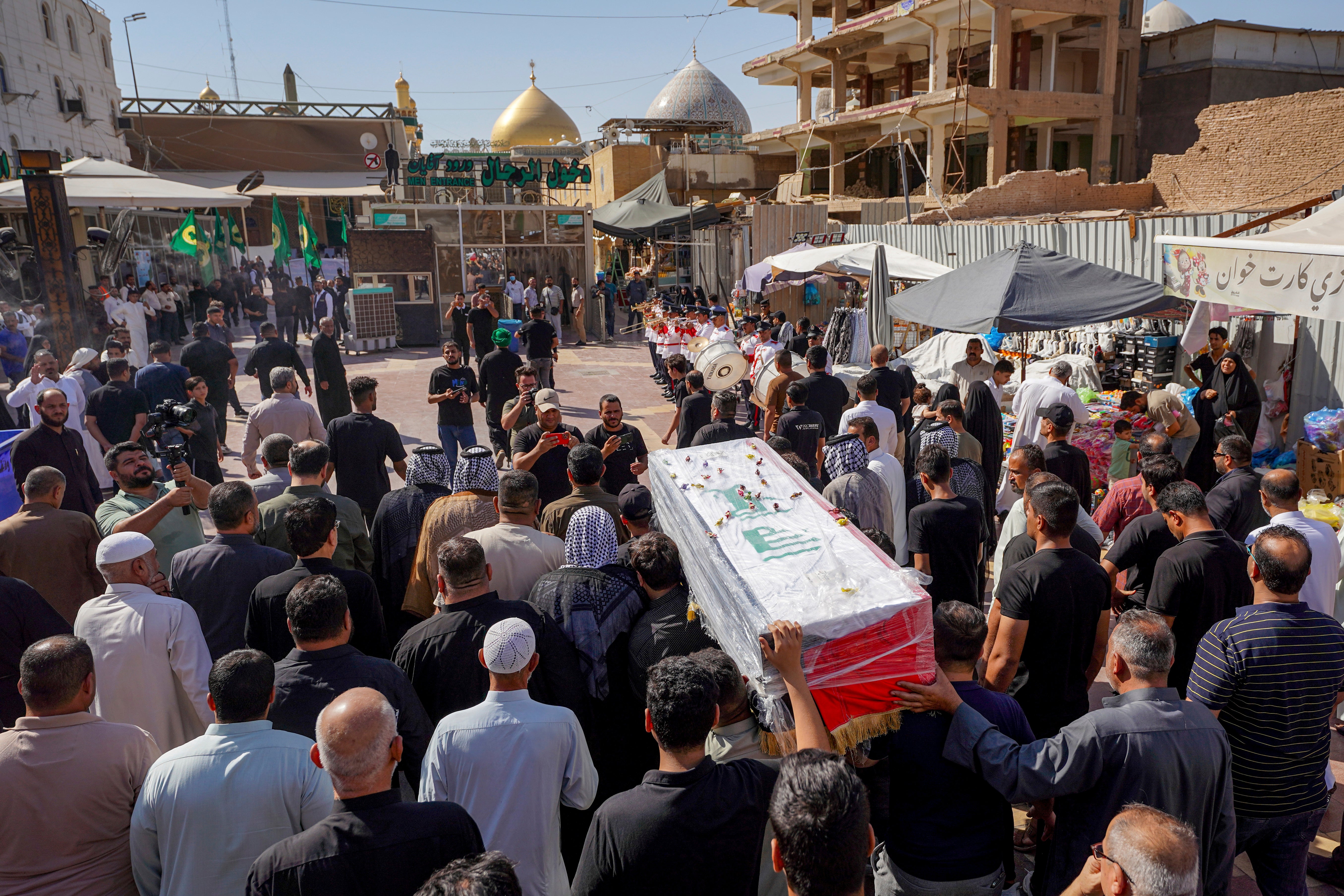 Mourners carried the coffin through the street