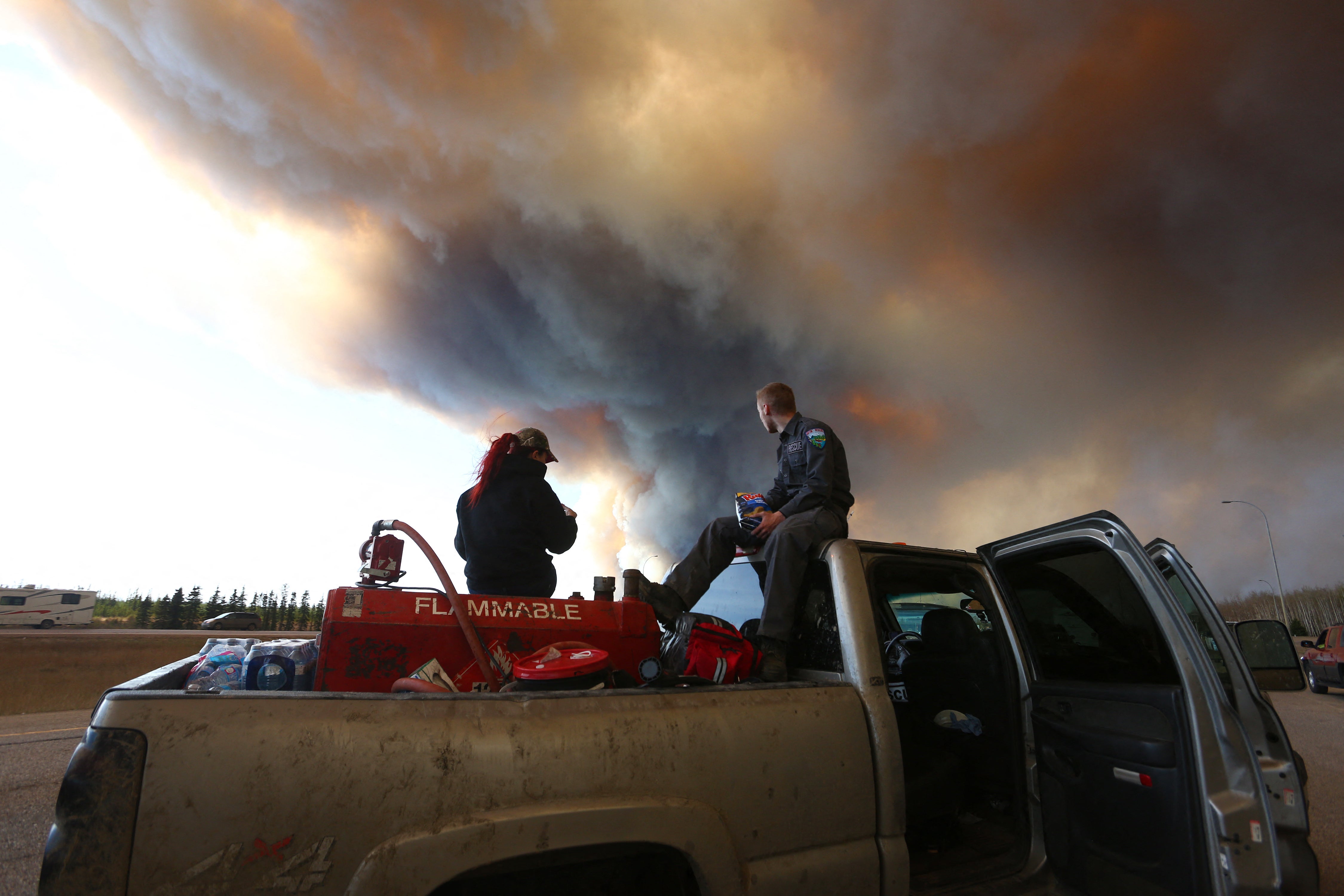 The smoke plume darkens the sky in Fort McMurray, Alberta, during the devastating wildfire of May 2016