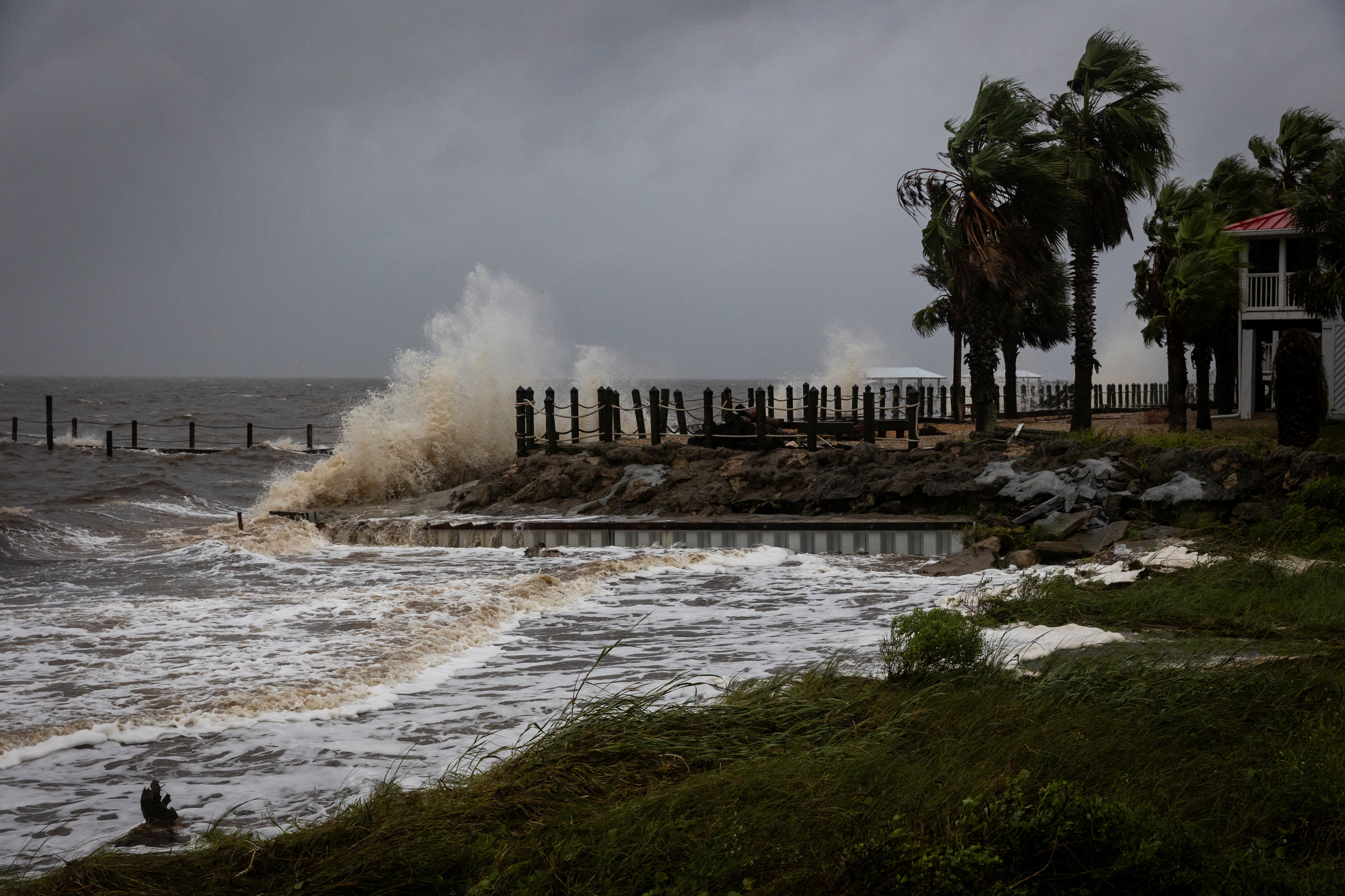 Waves impact a house seawall as Hurricane Helene intensifies Thursday before its expected landfall on Florida’s Big Bend