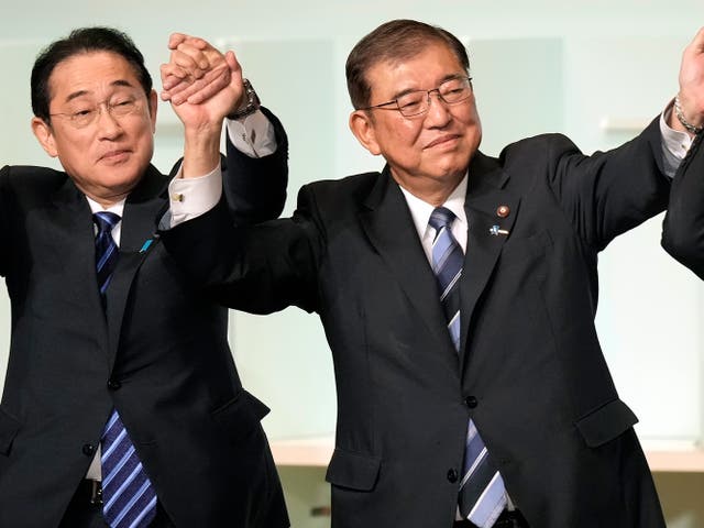 <p>Shigeru Ishiba, right, with Japan’s current prime minister Fumio Kishida, left, and other candidates, celebrates after Ishiba was elected as new head of Japan’s ruling Liberal Democratic Party during its leadership election Friday, 27 September 2024 in Tokyo</p>