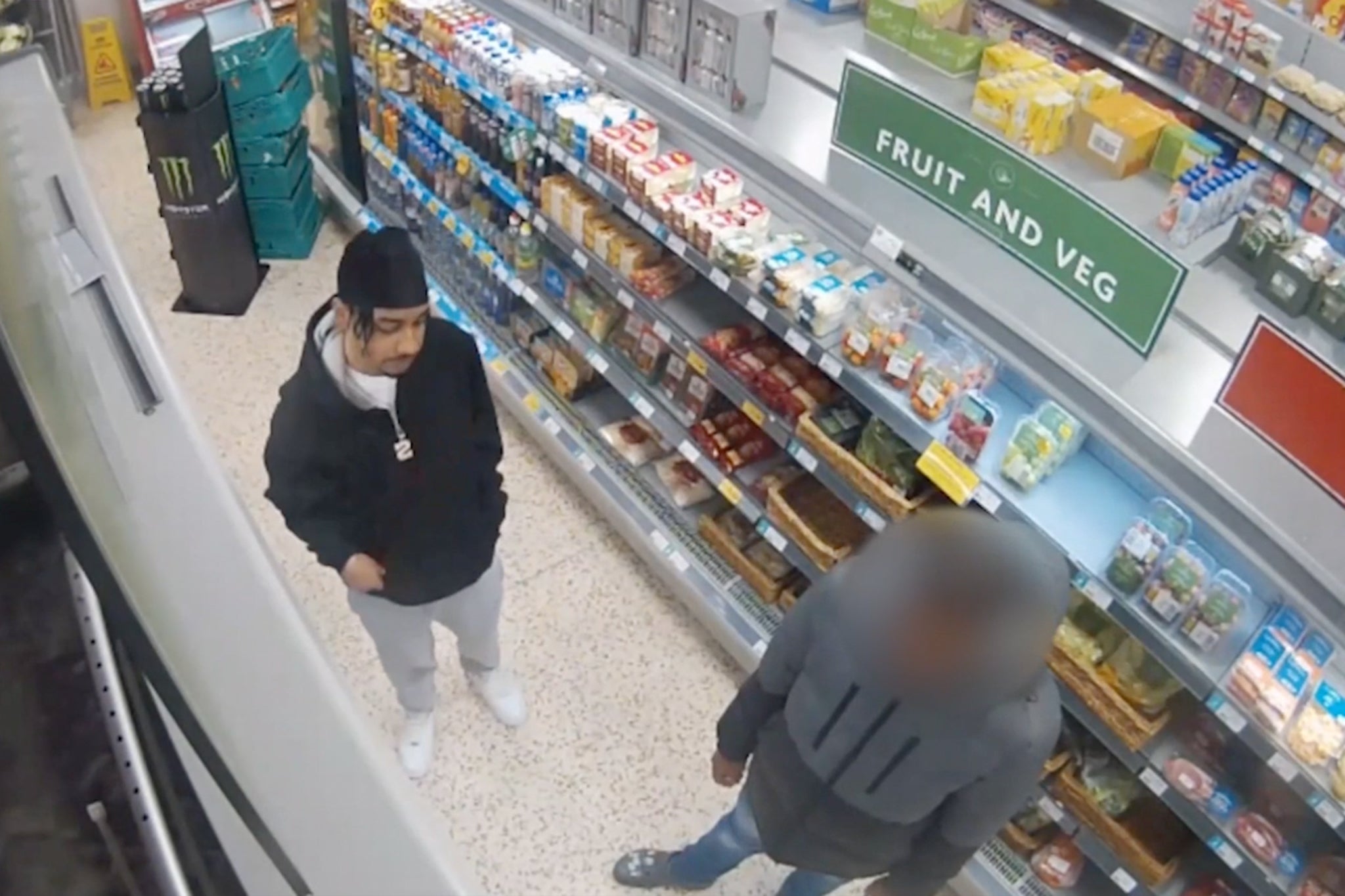 Mr Seesahai (right) seen with a friend in a Wolverhampton shop shortly before the machete attack that ended his life