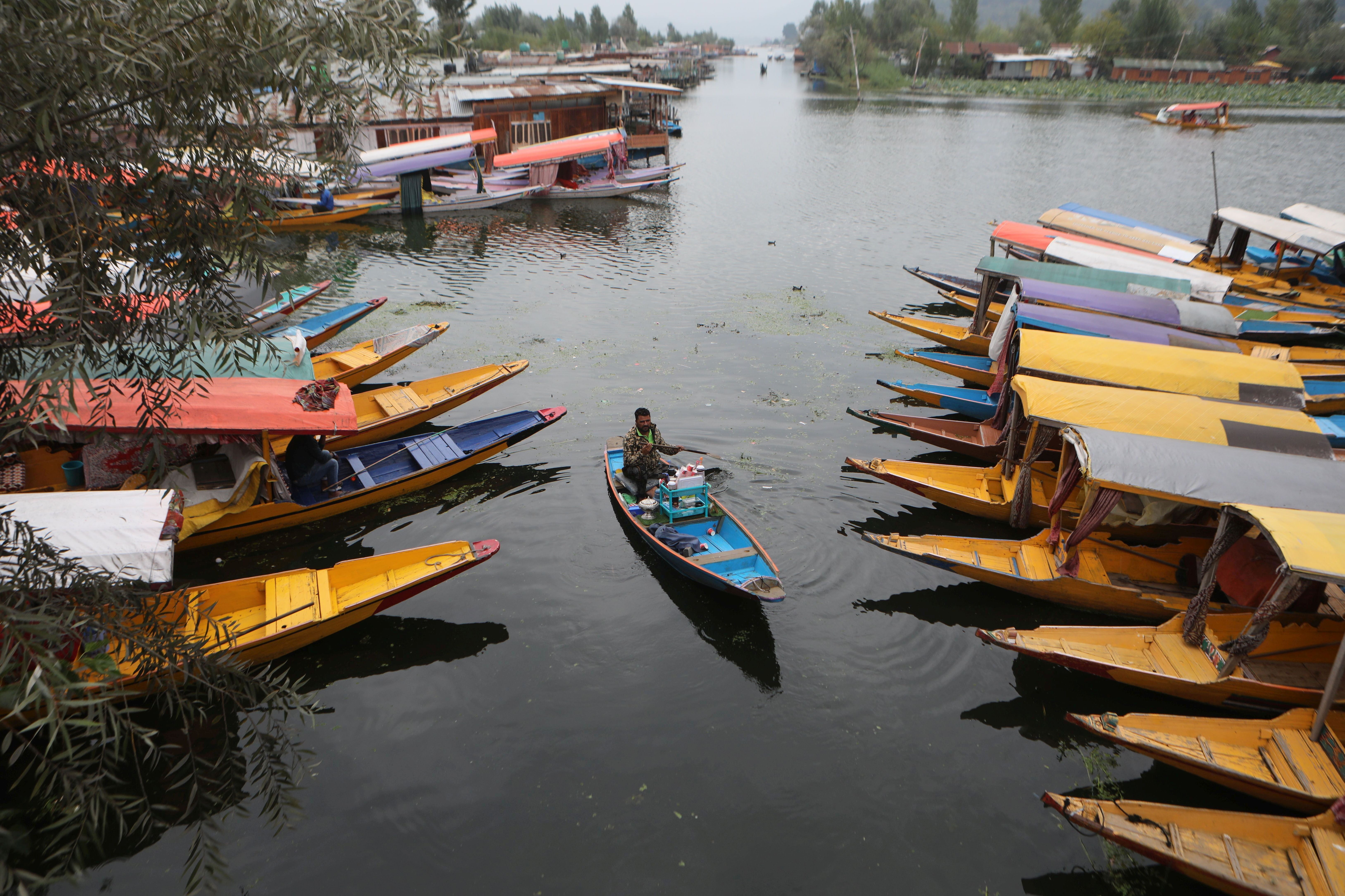 Tourists enjoy boat rides on Dal lake on World Tourism Day in Srinagar, Kashmir