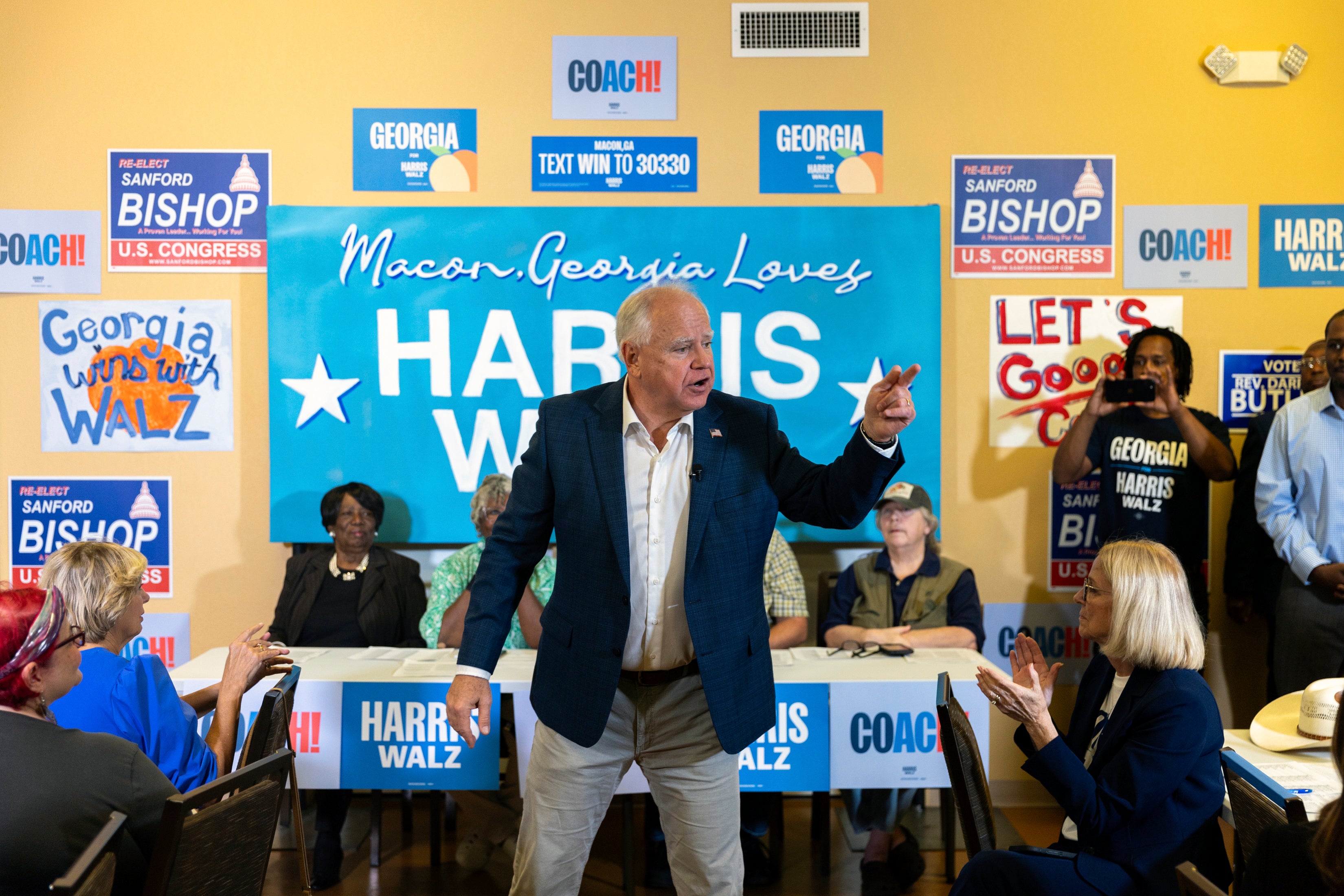 Tim Walz (speaking to supporters last month) is set to go head-to-head with JD Vance in the VP debate