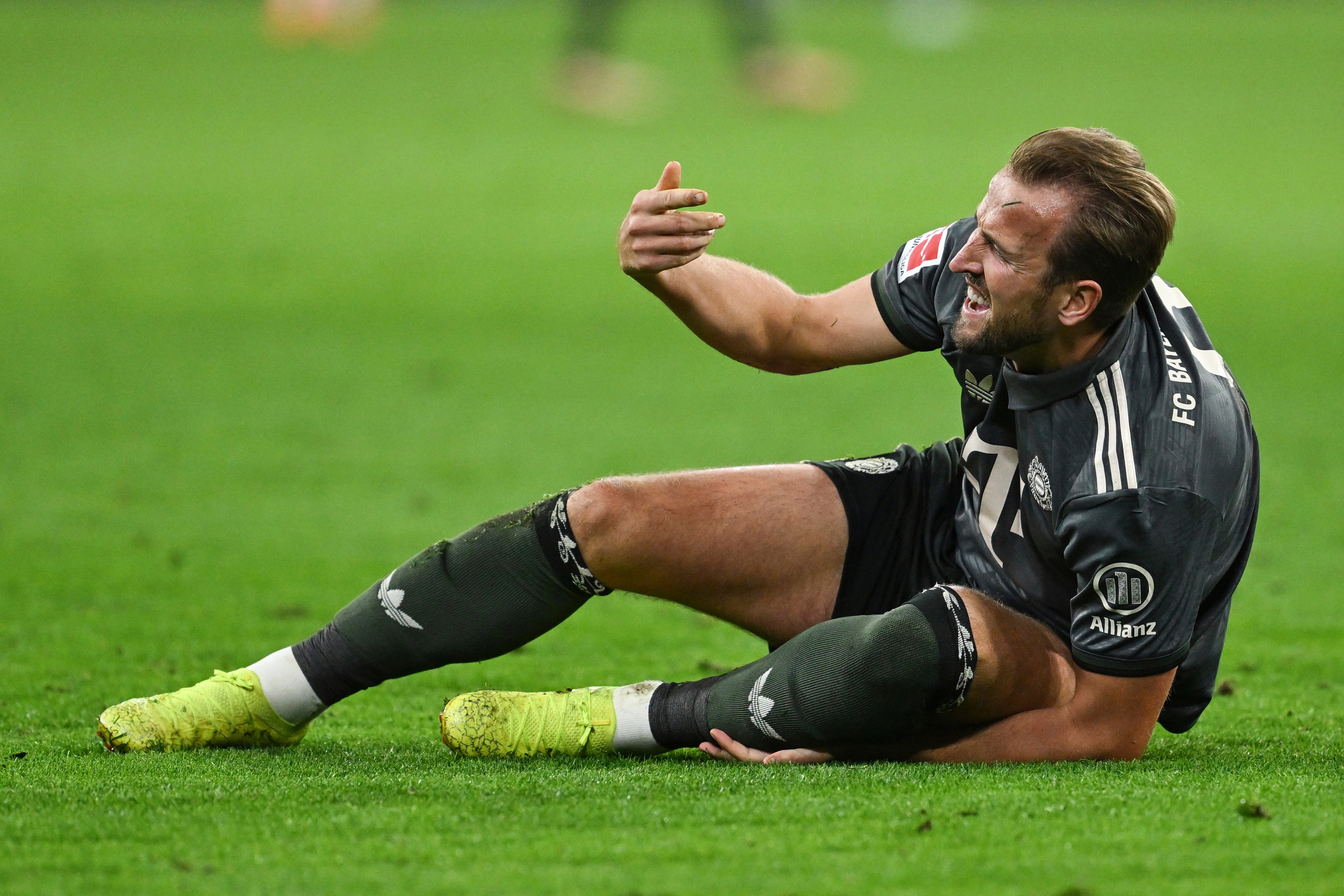 Harry Kane goes down during Bayern Munich’s draw with Bayer Leverkusen (Sven Hoppe/dpa via AP)