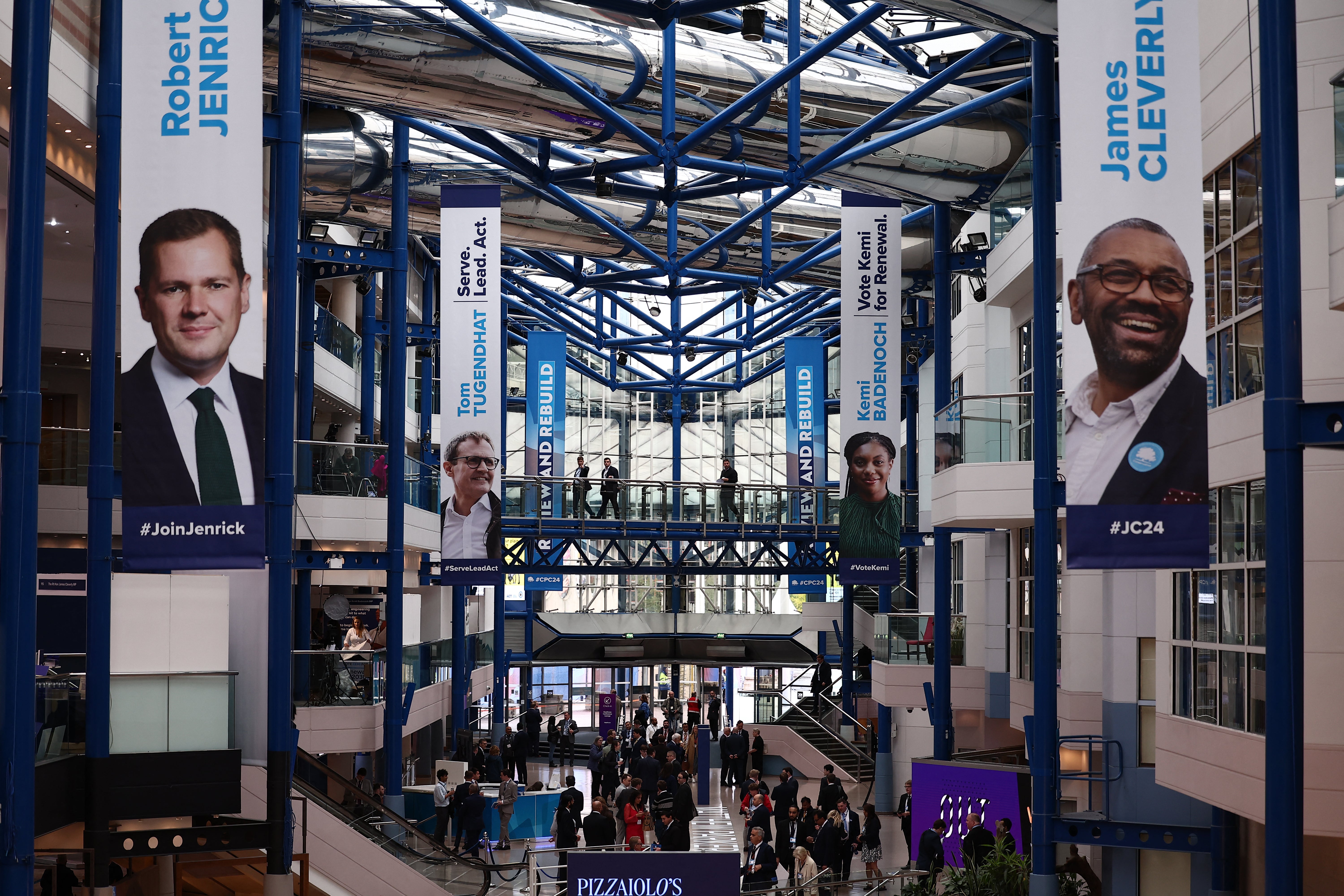 Large photographs of the four leadership candidates hang inside the International Convention Centre on the first full day at the annual Conservative Party Conference in Birmingham